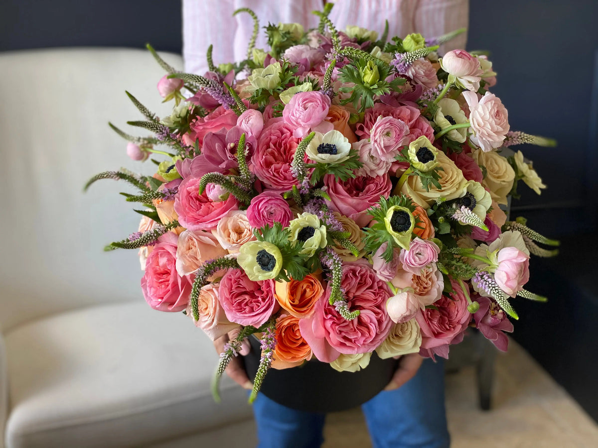 Large luxury flower box with roses ranunculus anemones and fresh greenery