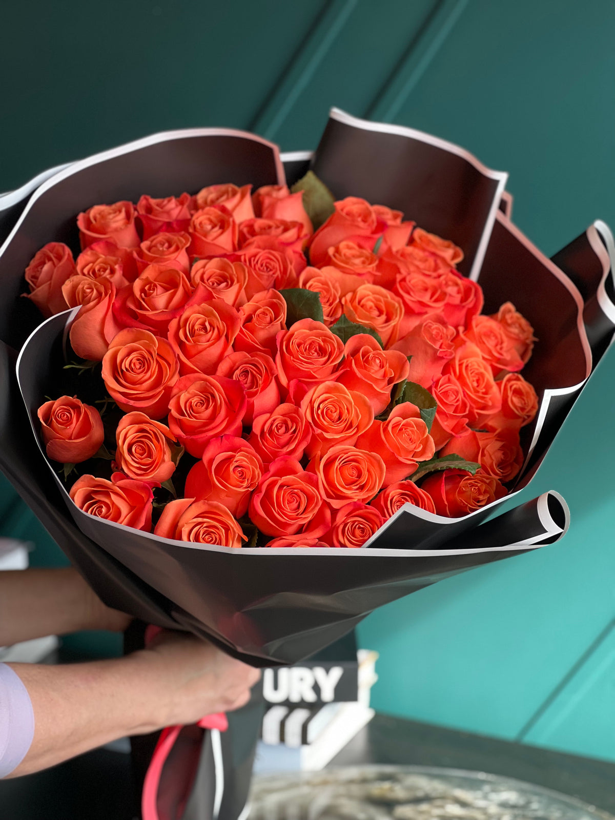 Large orange rose bouquet by Luxury Flowers Miami
