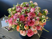 Large seasonal flower box with garden roses ranunculus and anemones