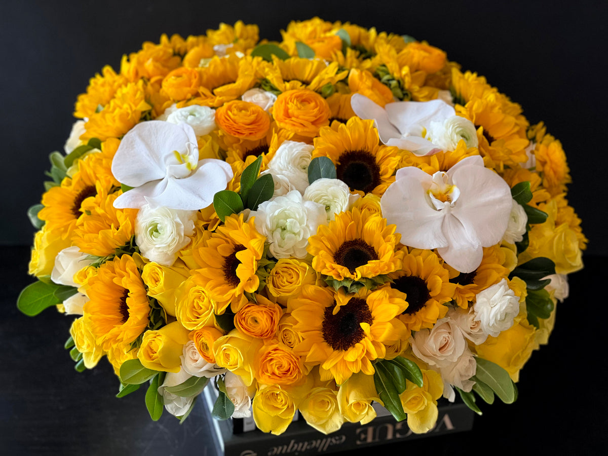 Large sunflower and roses centerpiece by Luxury Flowers Miami