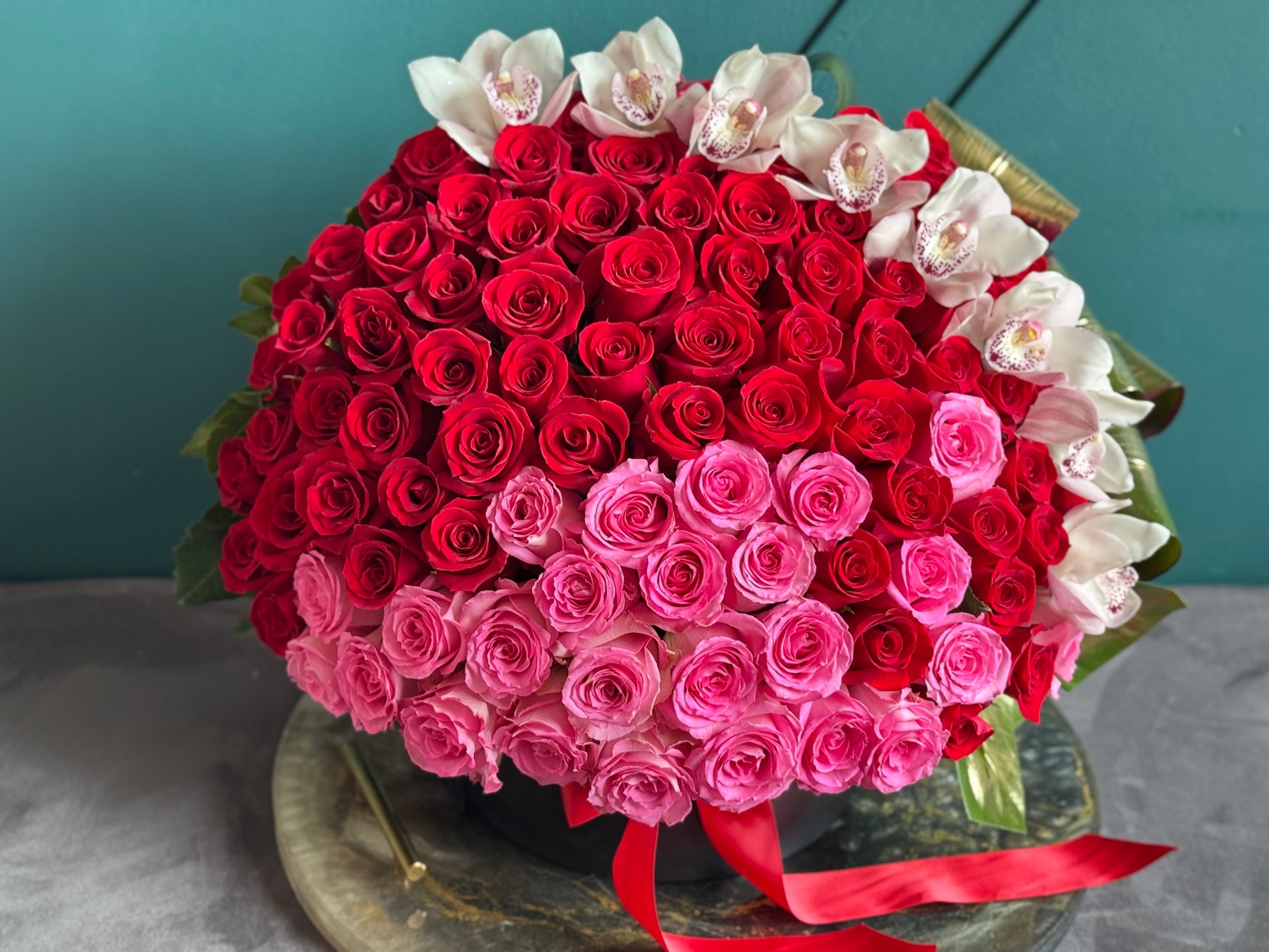 Luxury 150 rose arrangement with white cymbidium orchids Miami