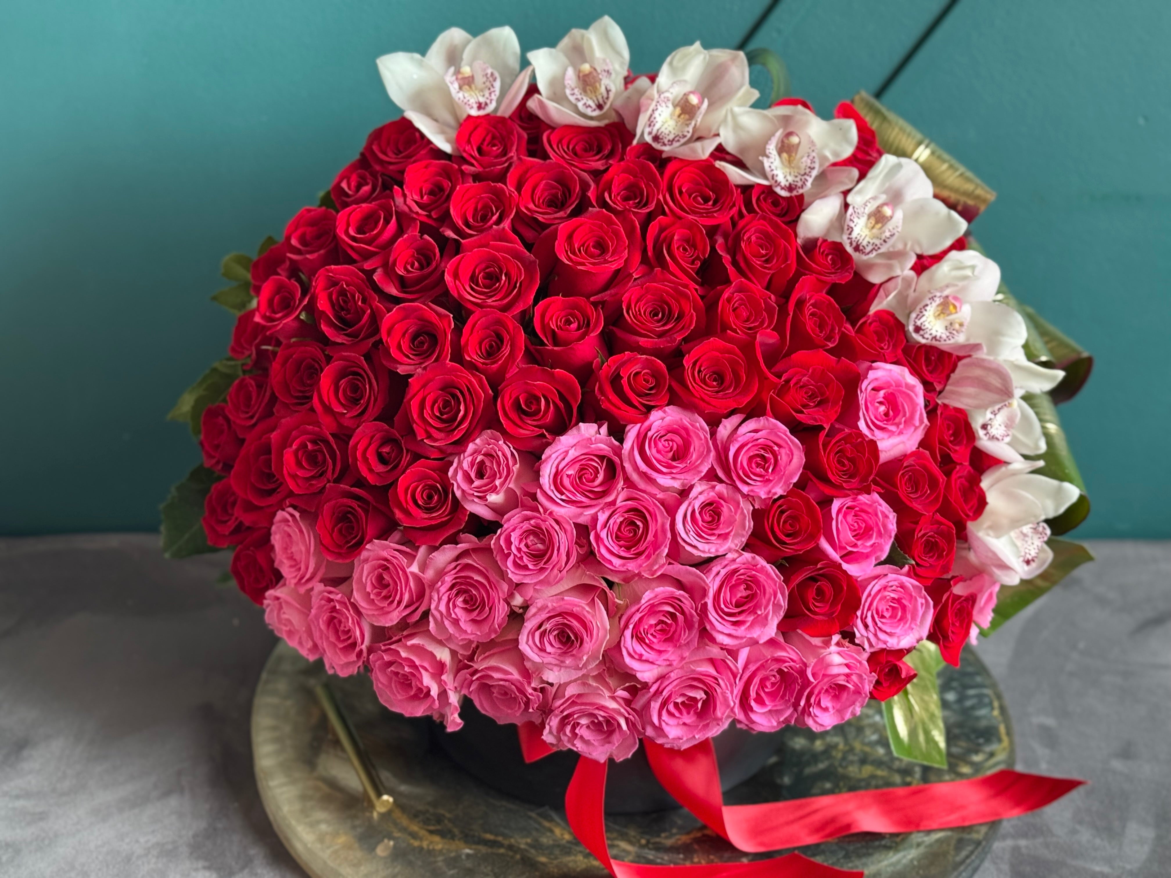 Luxury 150 rose arrangement with white cymbidium orchids Miami
