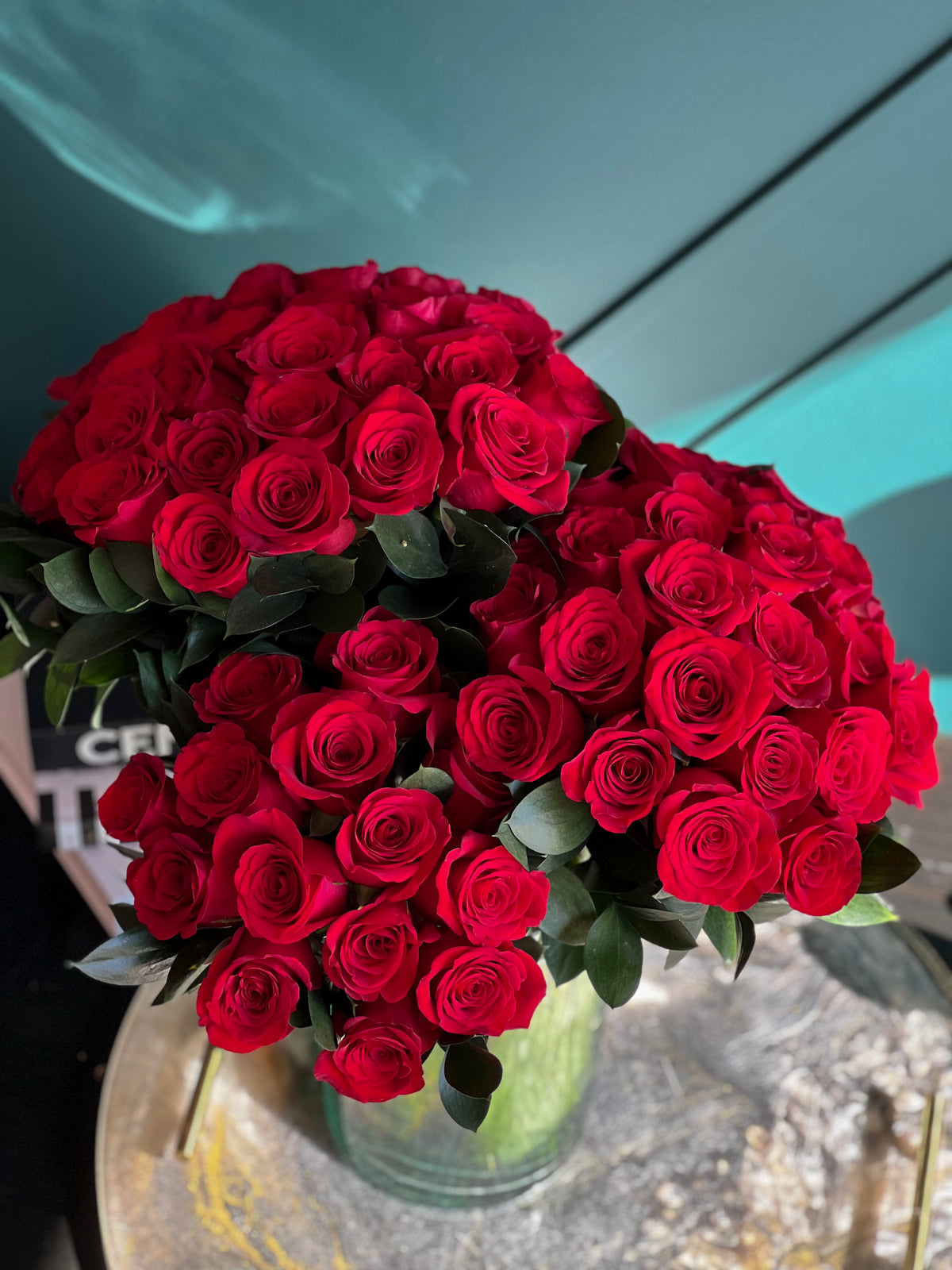 Luxury 72 red rose arrangement in clear glass vase