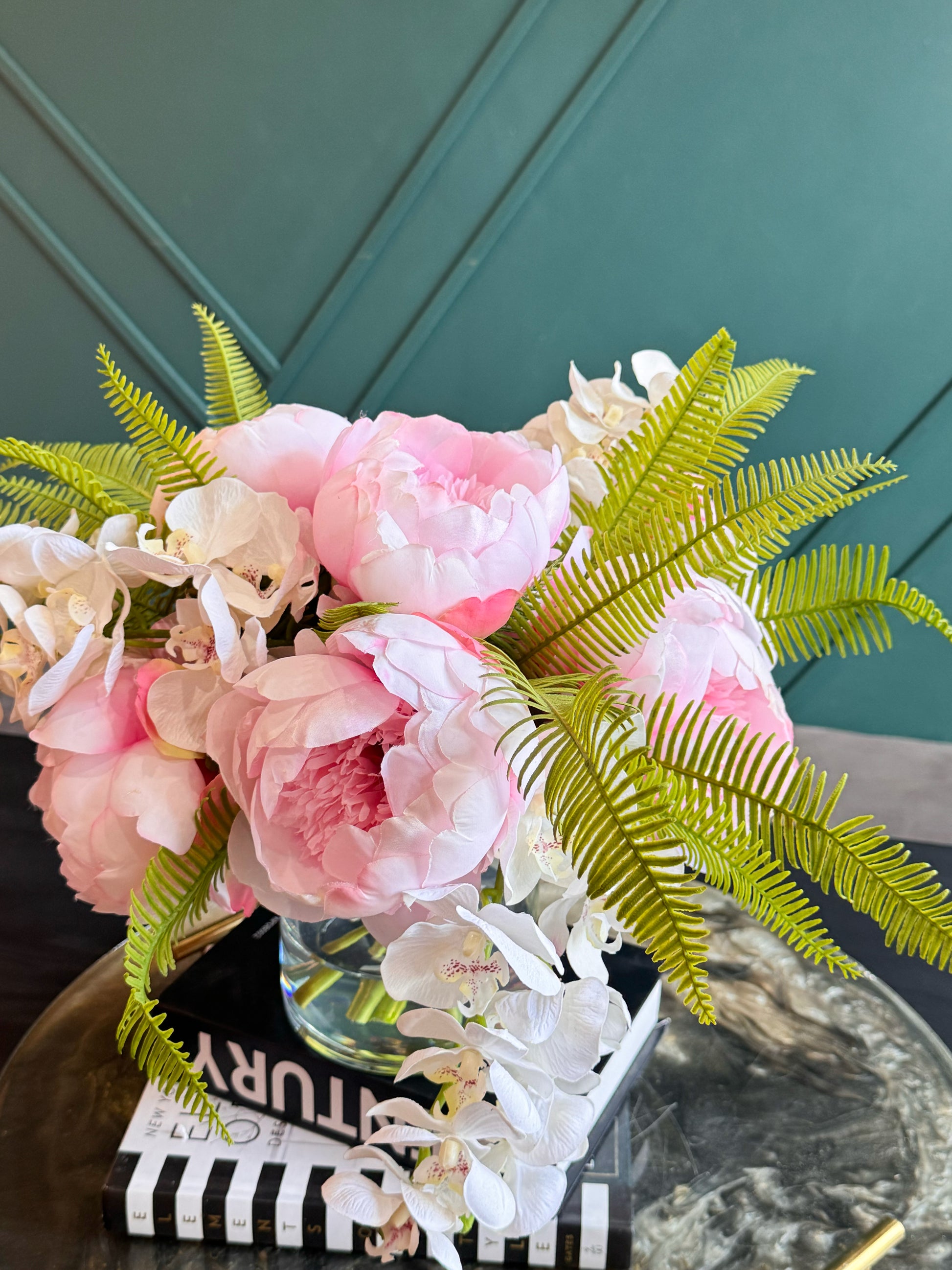 Luxury Flowers Miami handcrafted arrangement with Real Touch peonies, orchids, and decorative greenery.