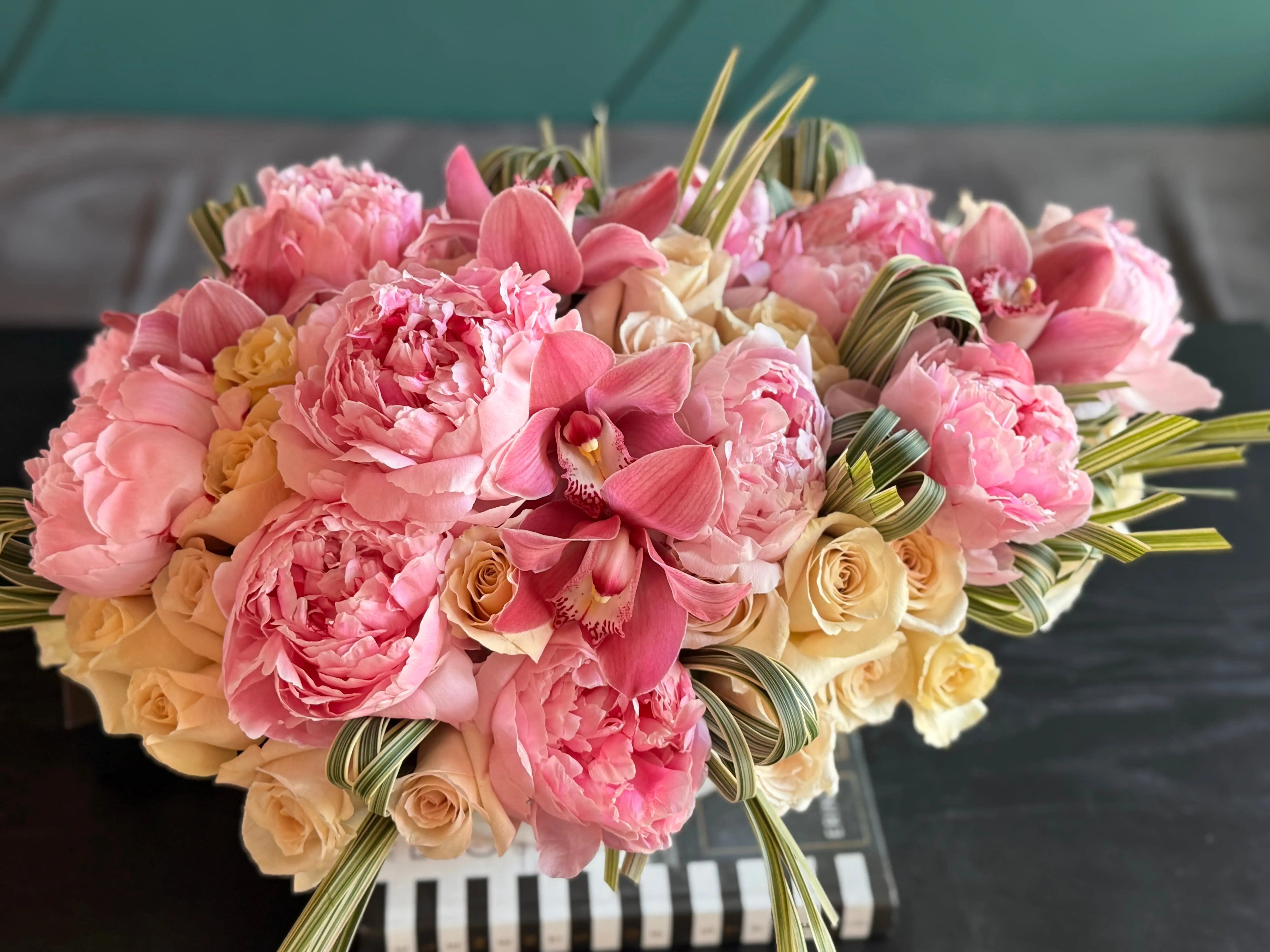 Luxury Miami flower delivery arrangement with peonies and cappuccino roses