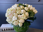 Luxury all-white flower arrangement in clear glass vase
