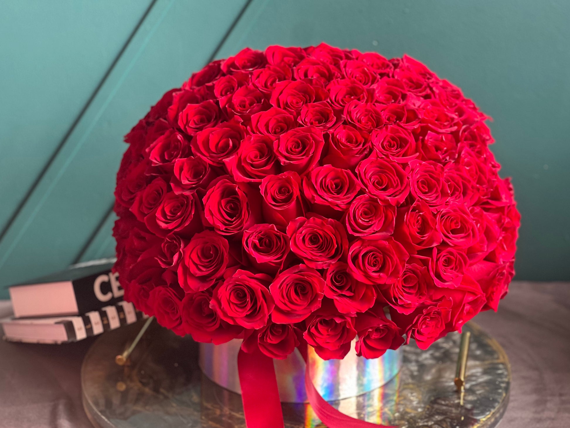 Luxury arrangement of 100 red roses in a box
