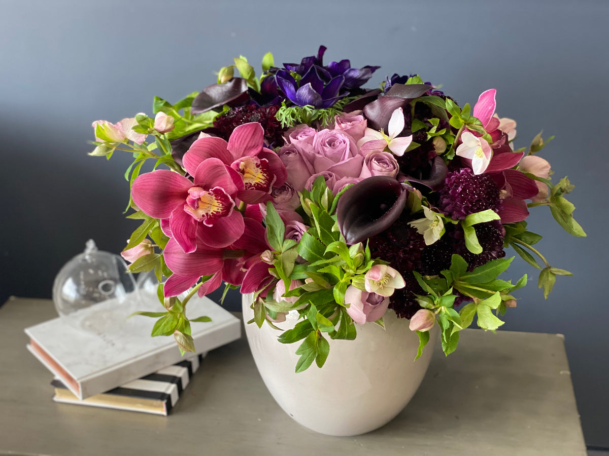 Luxury arrangement with purple roses and calla lilies