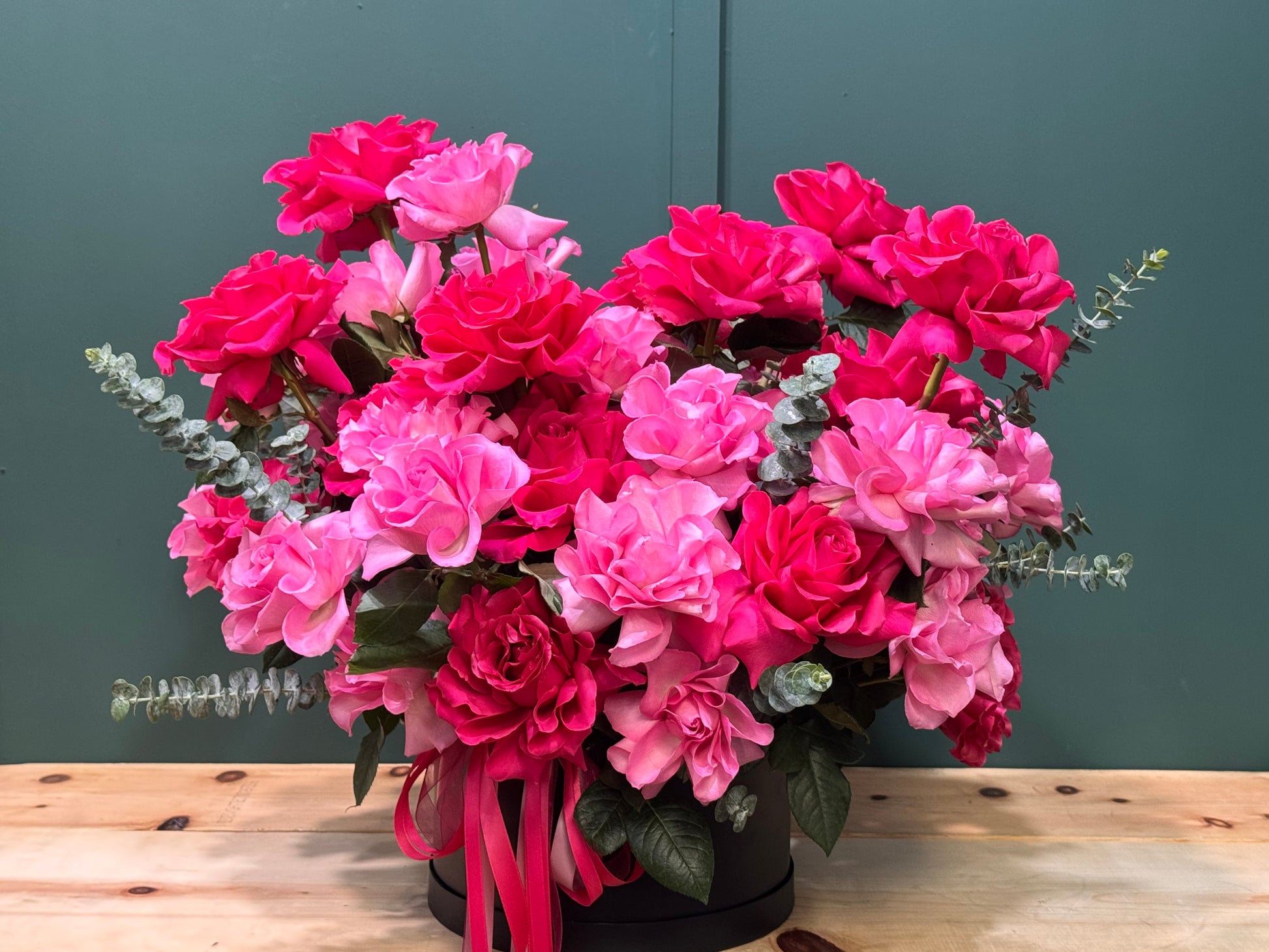 Luxury black box arrangement with 50 French roses by Luxury Flowers Miami