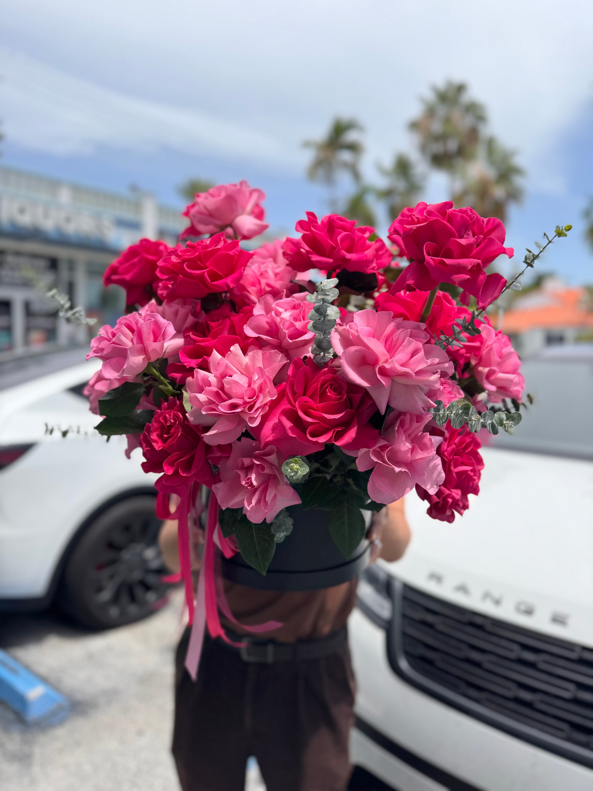 Luxury black flower box filled with fresh pink French roses