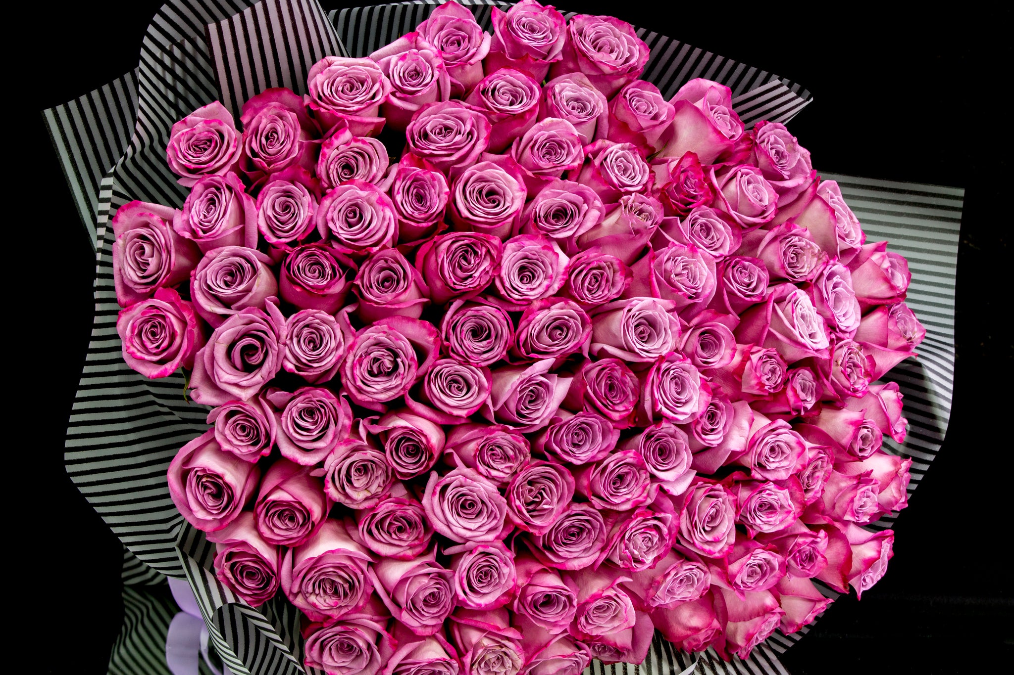 Luxury bouquet of 100 deep purple roses by Luxury Flowers Miami