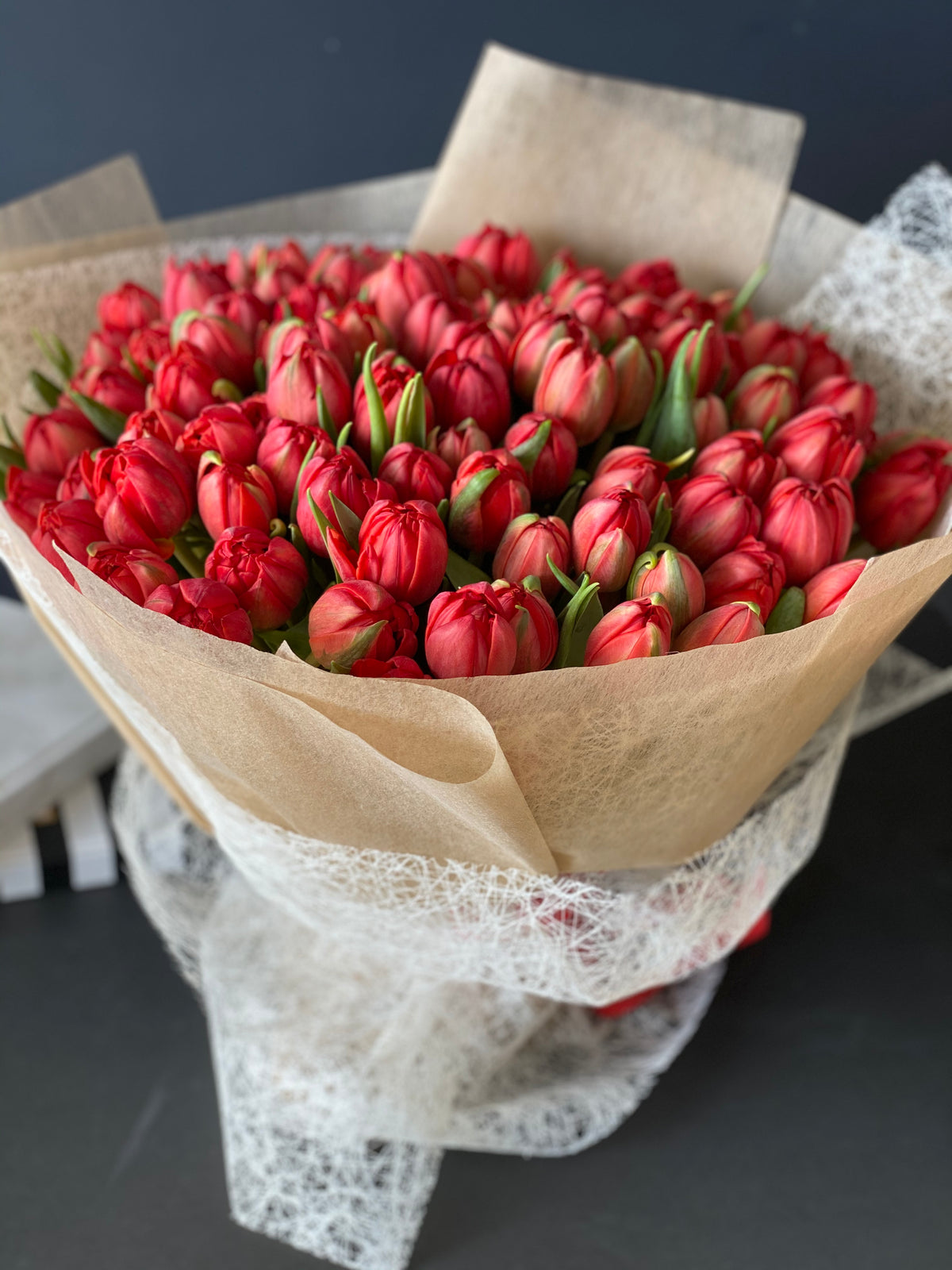 Luxury bouquet of 100 fresh red tulips for Miami delivery