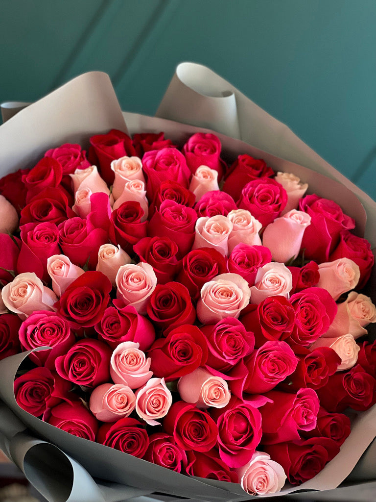 Luxury bouquet of 75 assorted red light pink and hot pink roses by Luxury Flowers Miami

