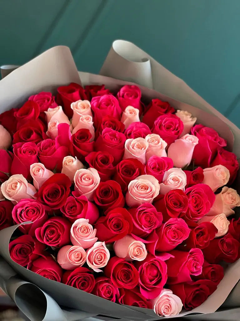 Luxury bouquet of 75 assorted red light pink and hot pink roses by Luxury Flowers Miami
