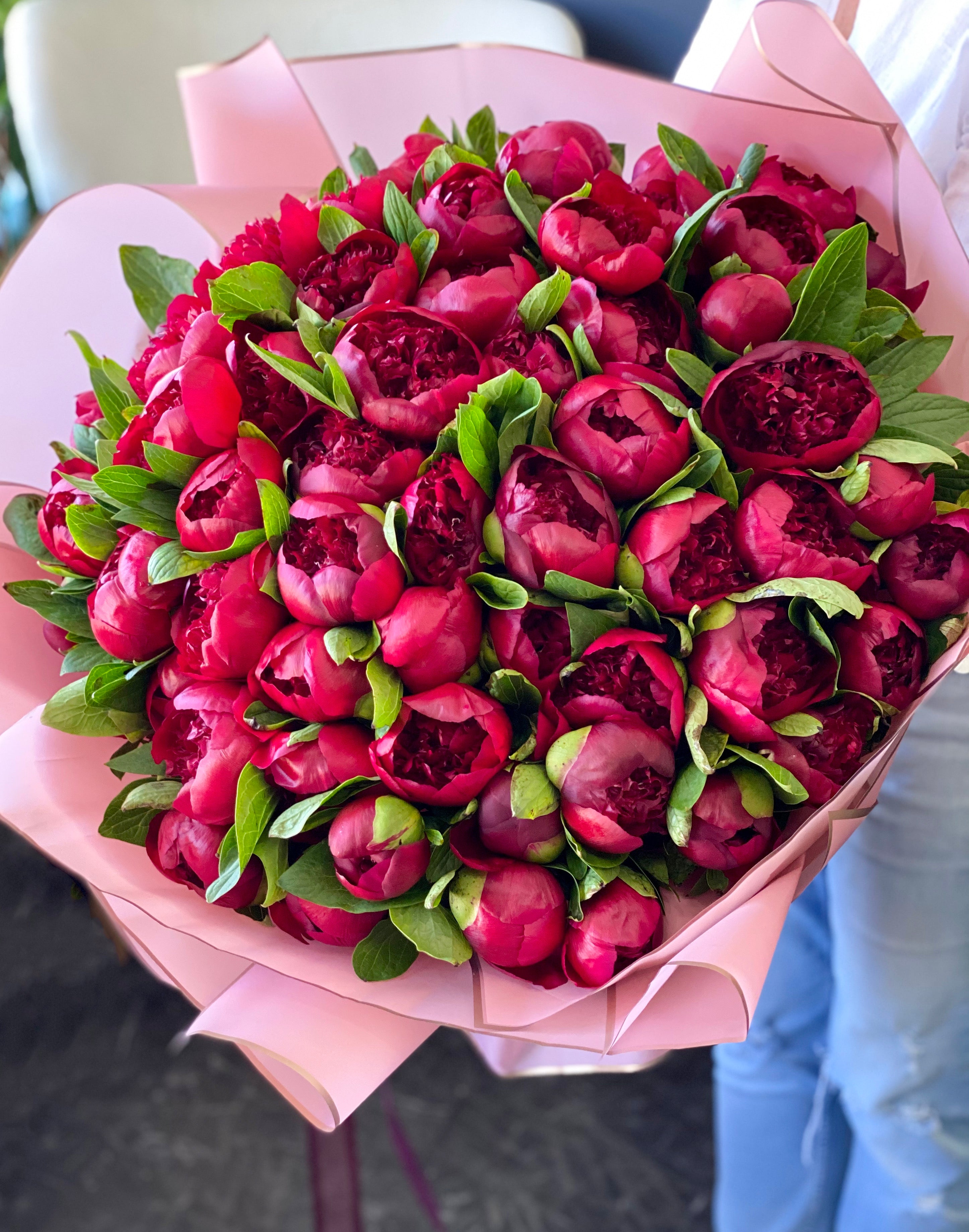 Luxury burgundy peony bouquet with pink wrapping