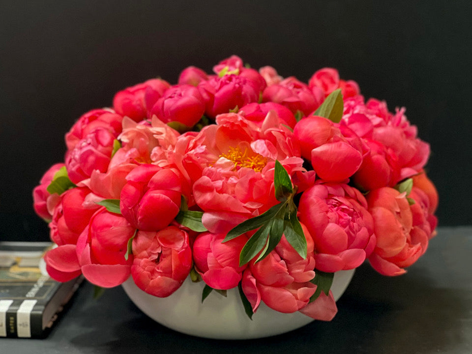 Luxury coral peonies in artisan cement vase