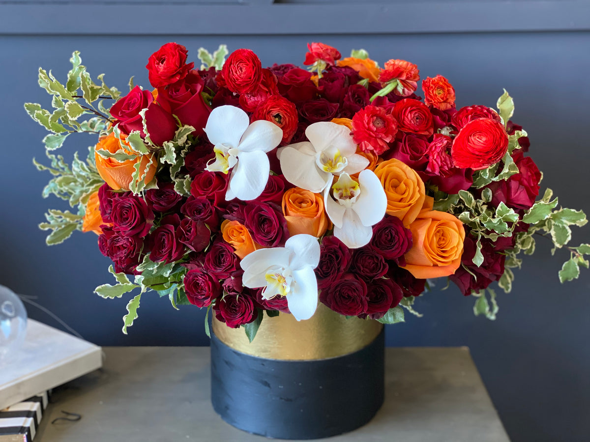 Luxury fall flower box arrangement with roses and orchids in Miami