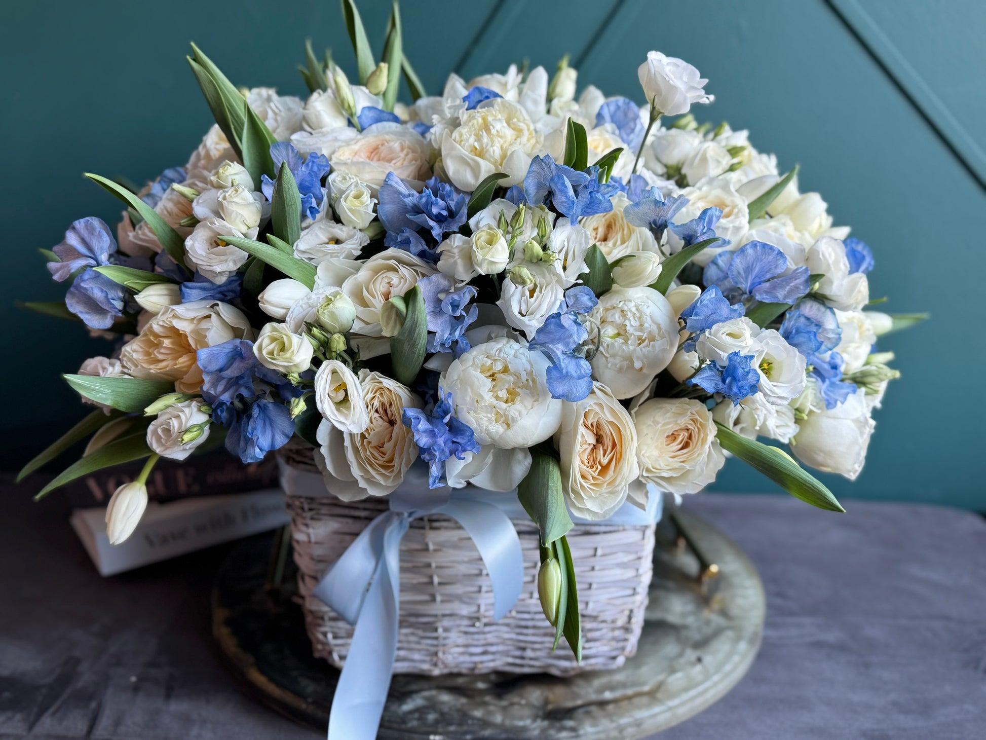 Luxury floral basket with ivory peonies blue flowers and garden roses