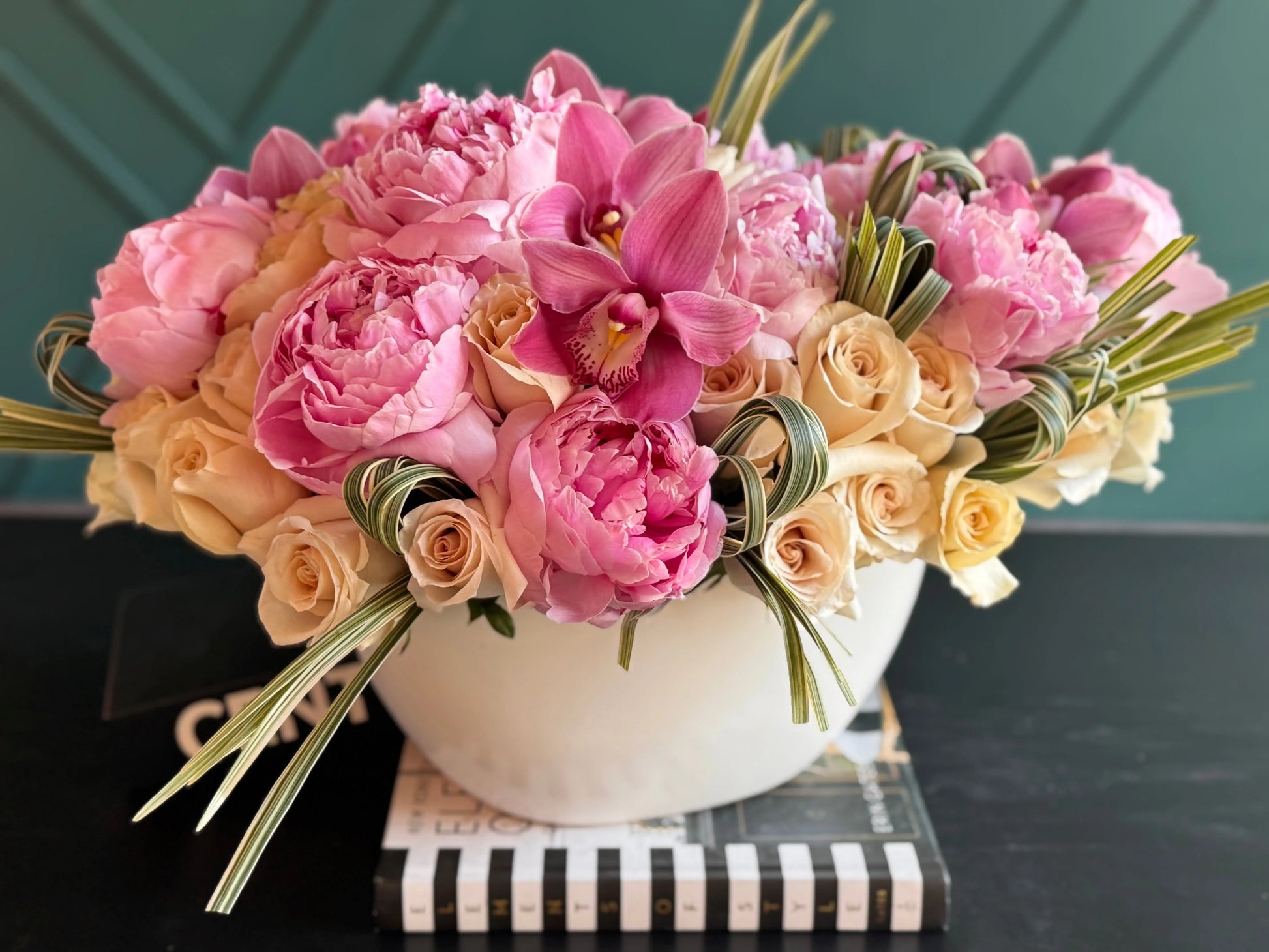 Luxury flower arrangement with peonies cappuccino roses and orchids in Miami
