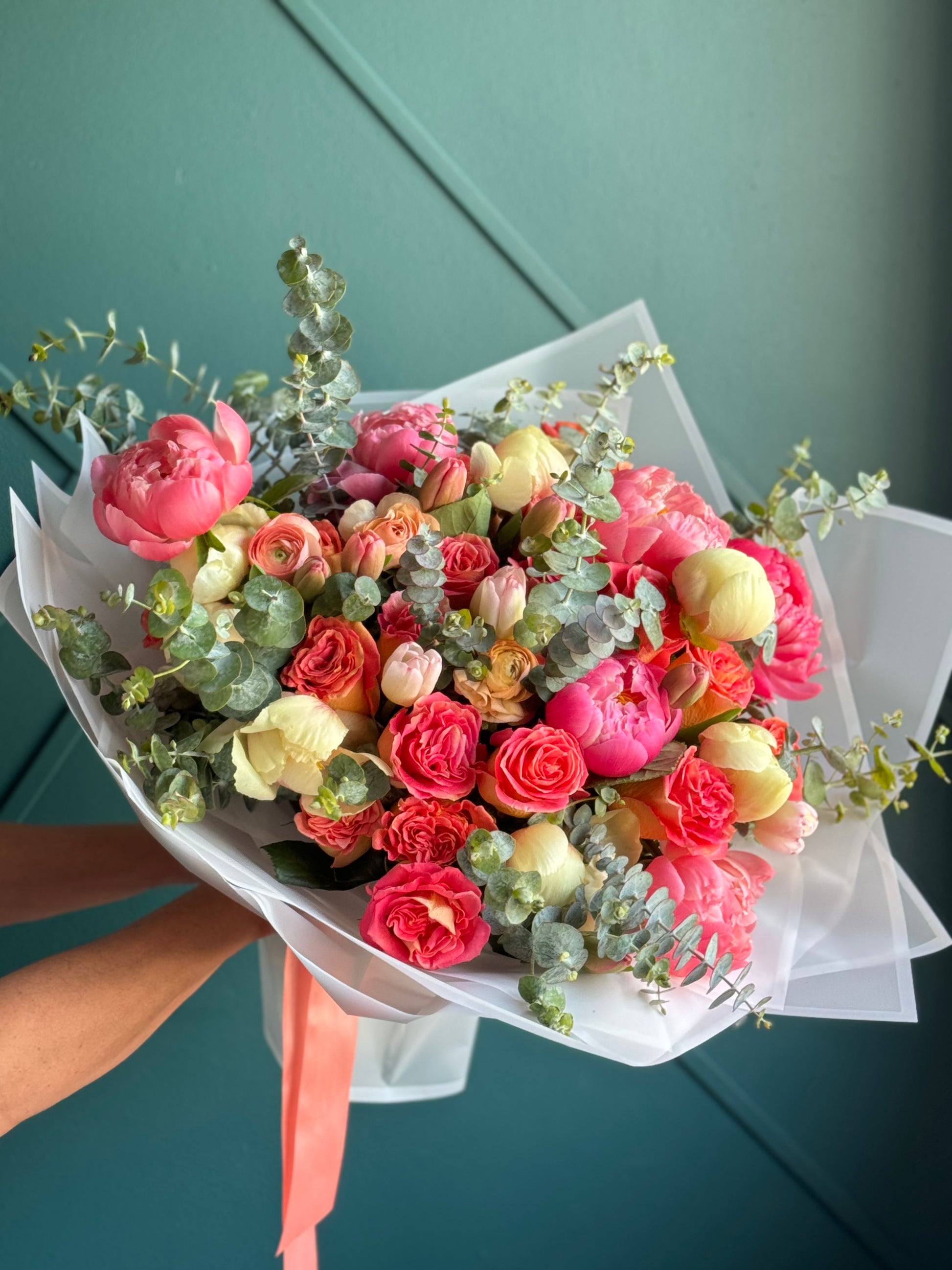 Luxury flower bouquet with coral roses peonies and tulips
