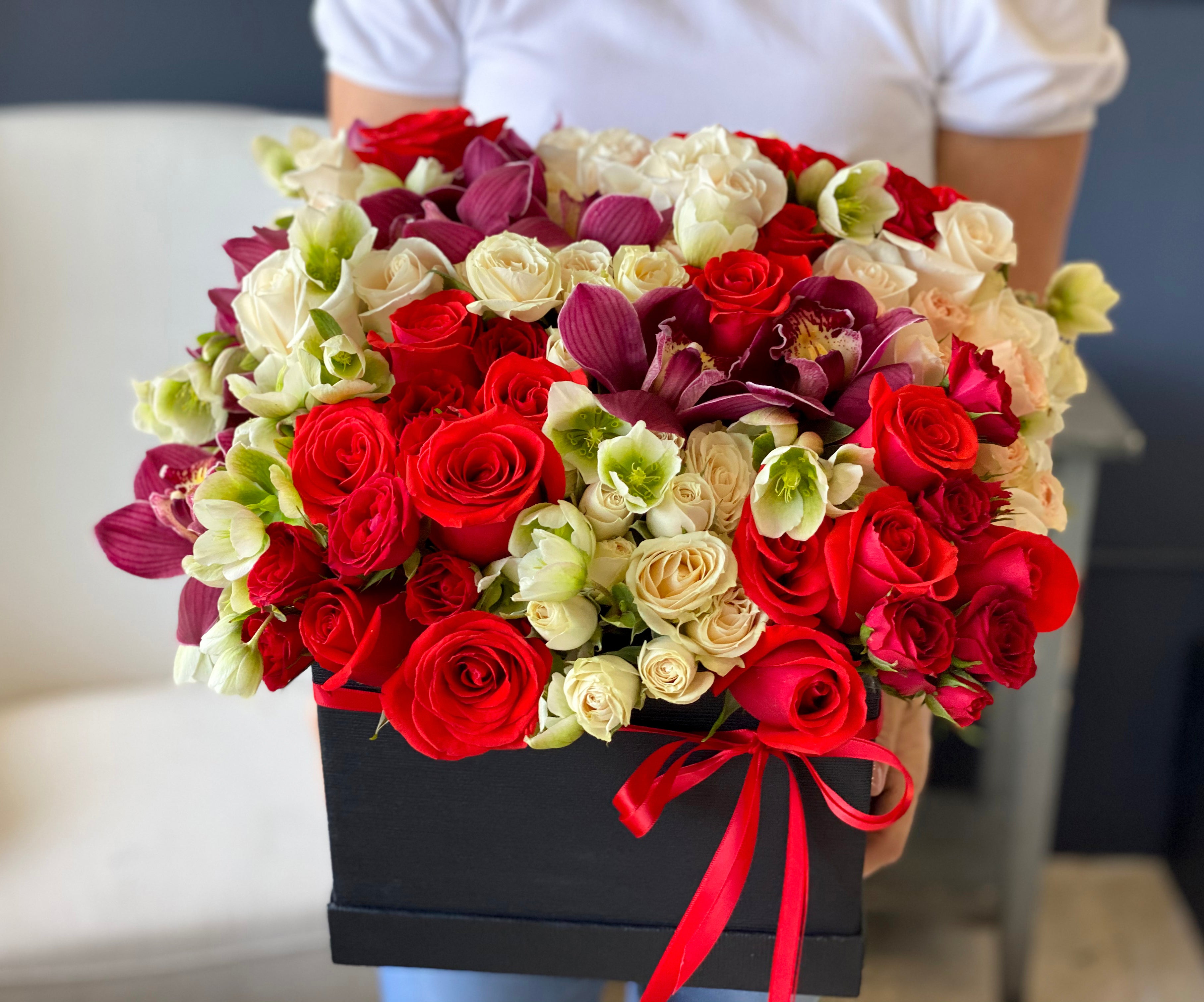 Luxury flower box Miami with red white roses and cymbidium orchids
