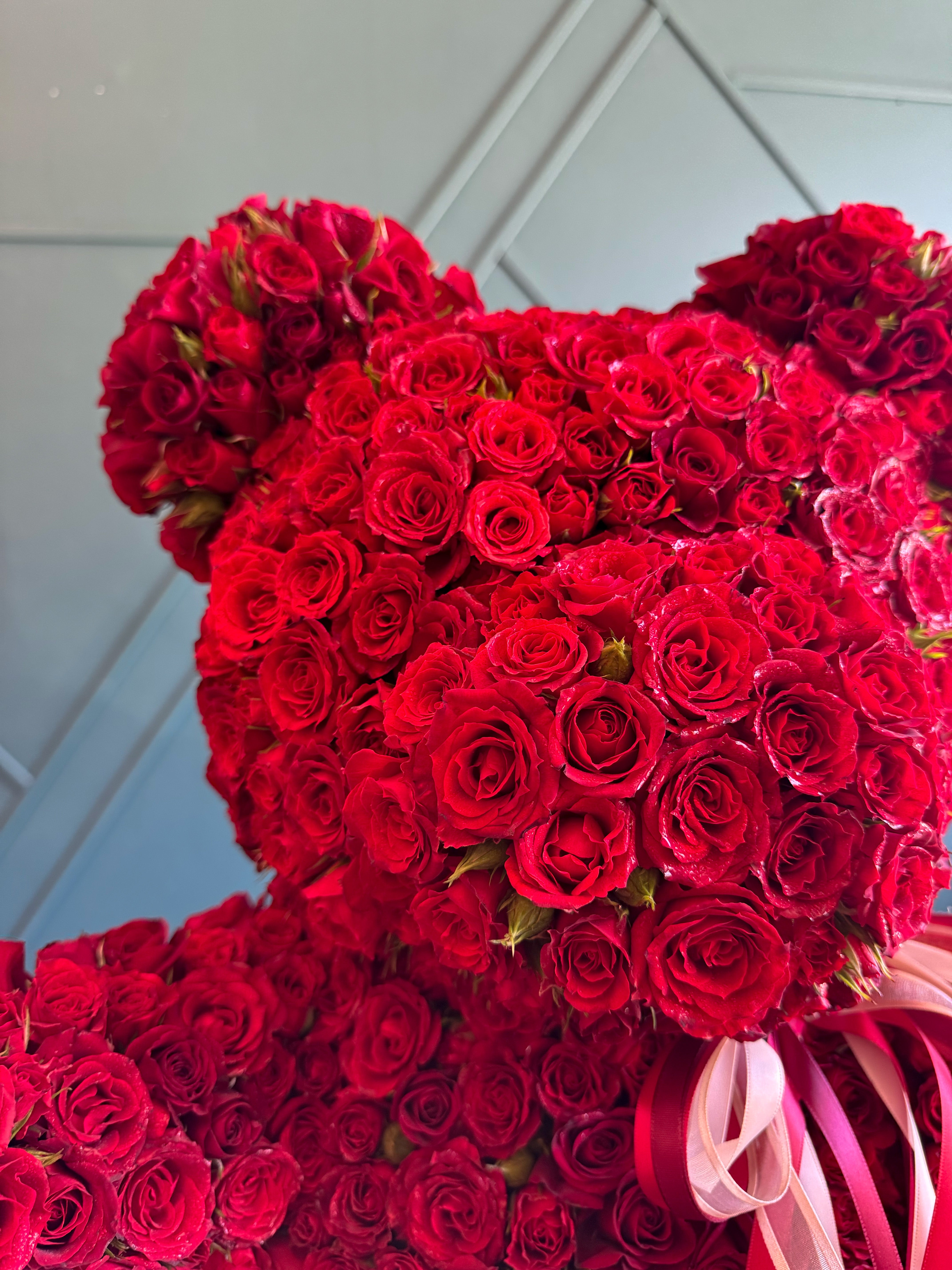 Luxury fresh flower teddy bear made with red roses in Miami Beach
