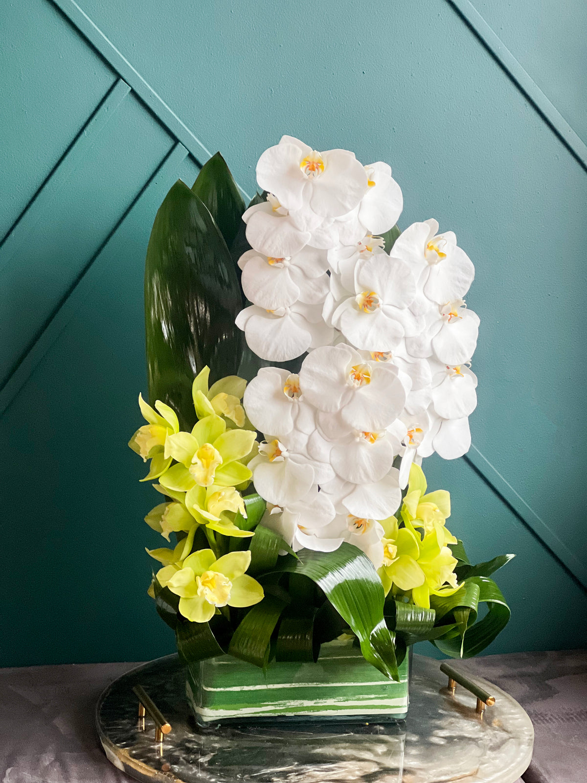 Luxury orchid arrangement in rectangular glass vase Miami
