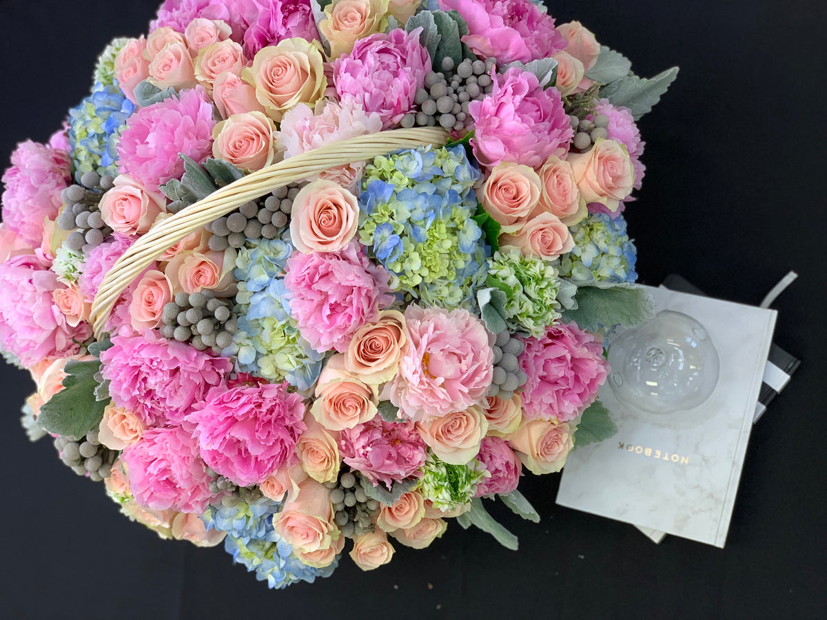 Luxury pastel flower basket handcrafted by Luxury Flowers Miami