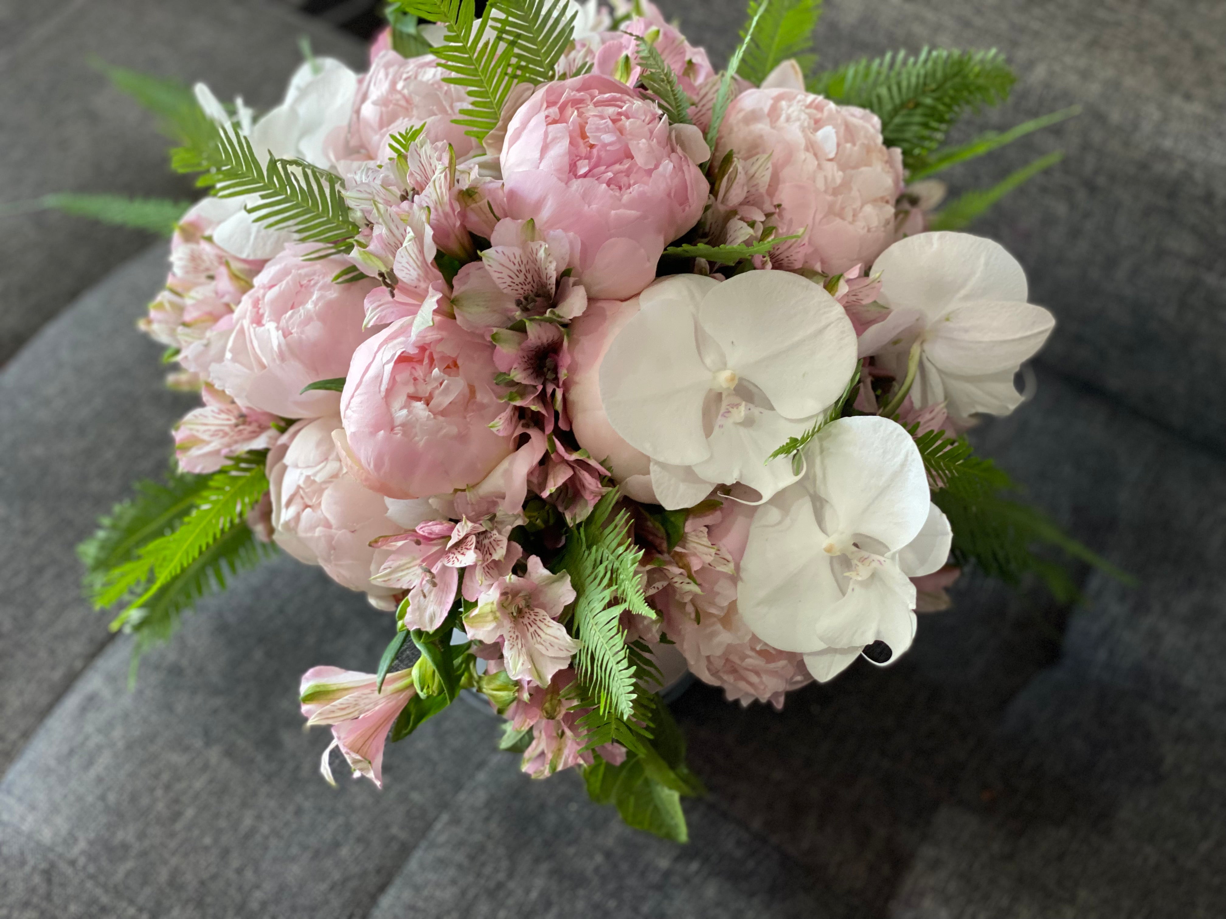 Luxury pink peonies in vase with Miami delivery