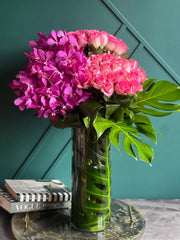 Luxury roses and mokara orchids arrangement in glass vase
