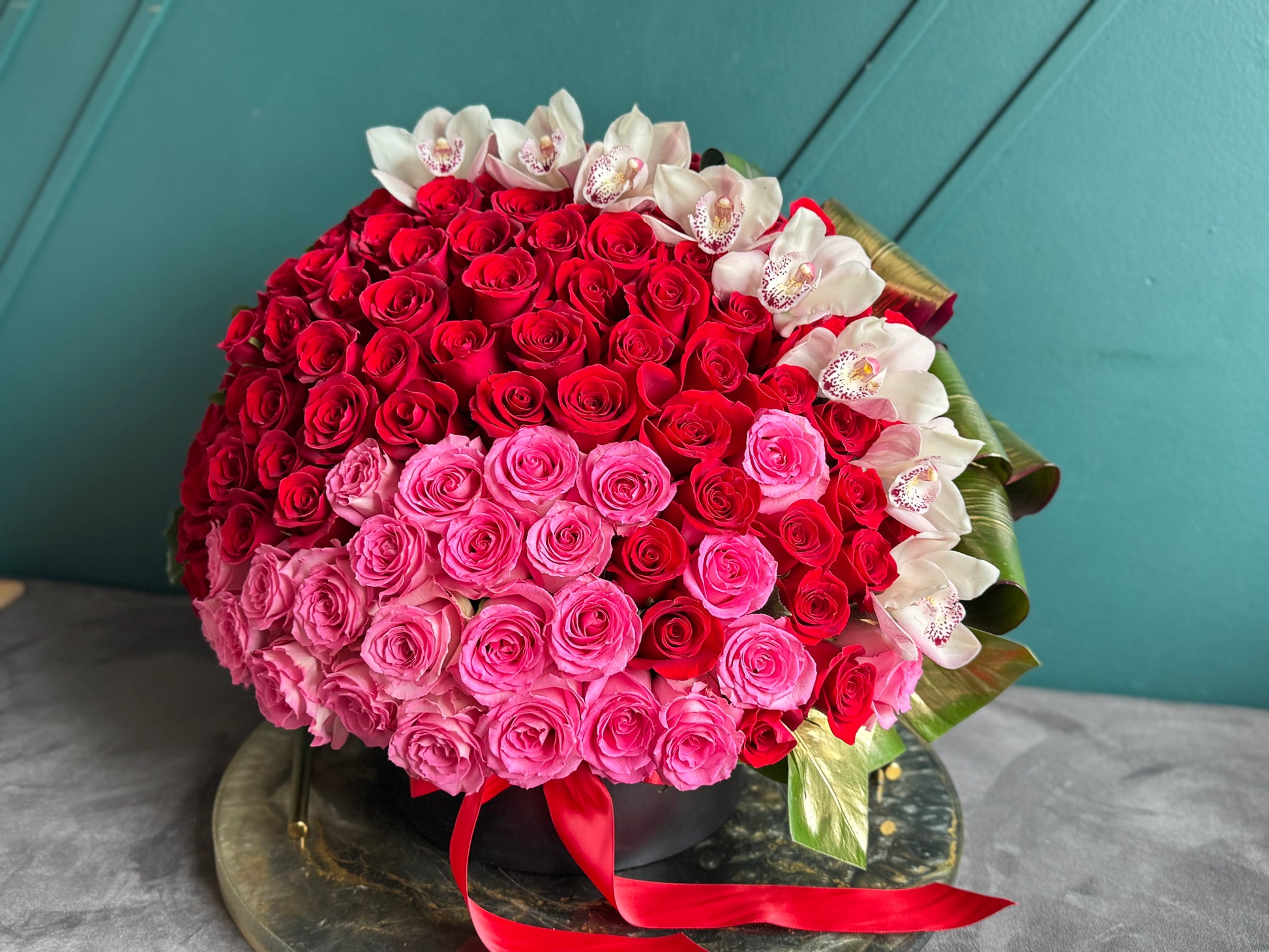 Luxury roses and white cymbidium orchids handcrafted in Miami