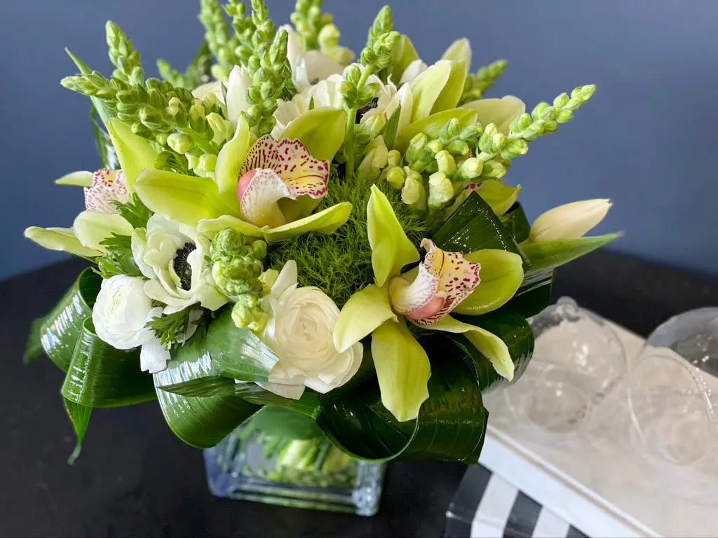 Luxury white flower arrangement with orchids and greenery Miami
