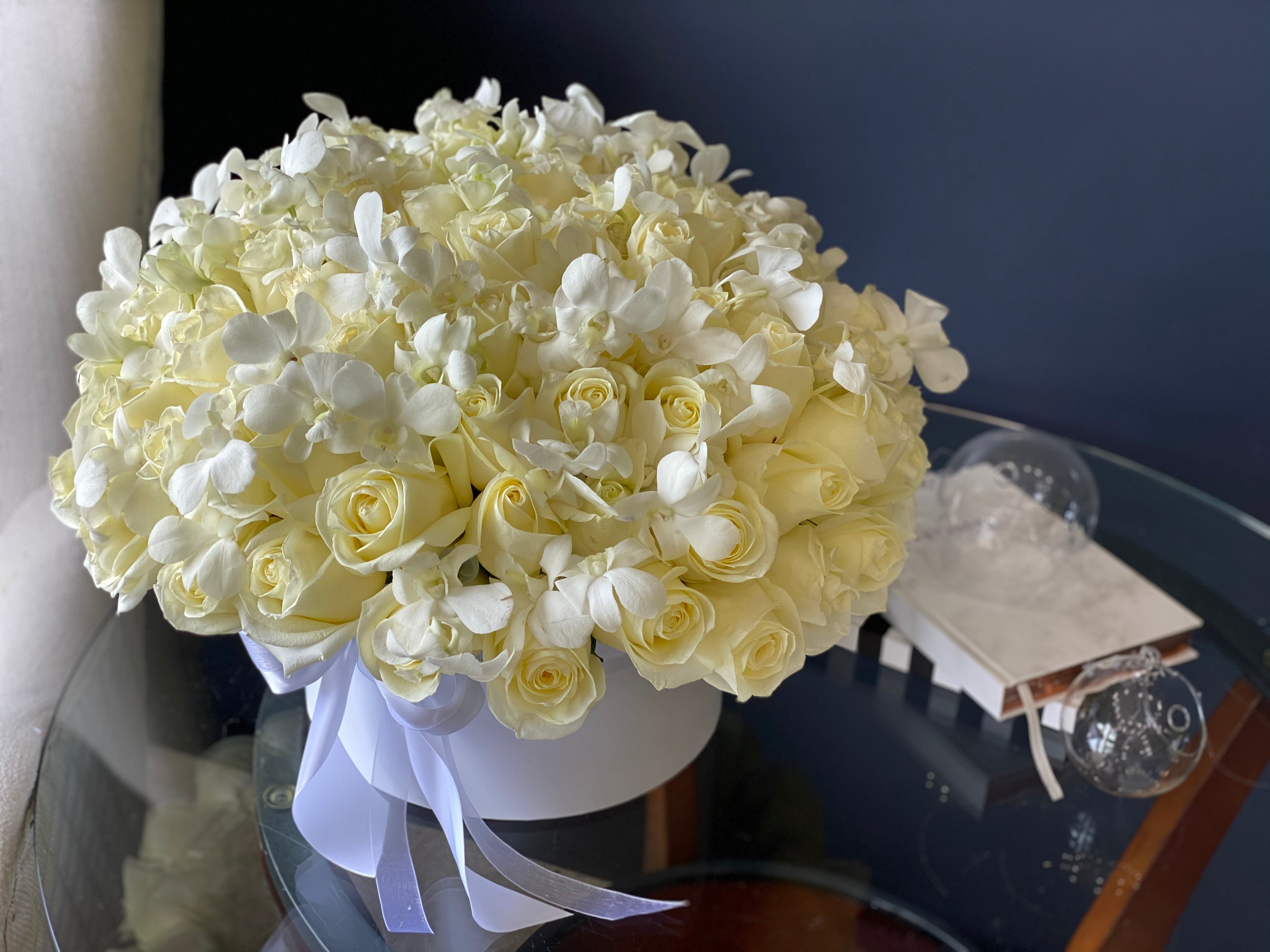 Luxury white flower box with roses and orchids