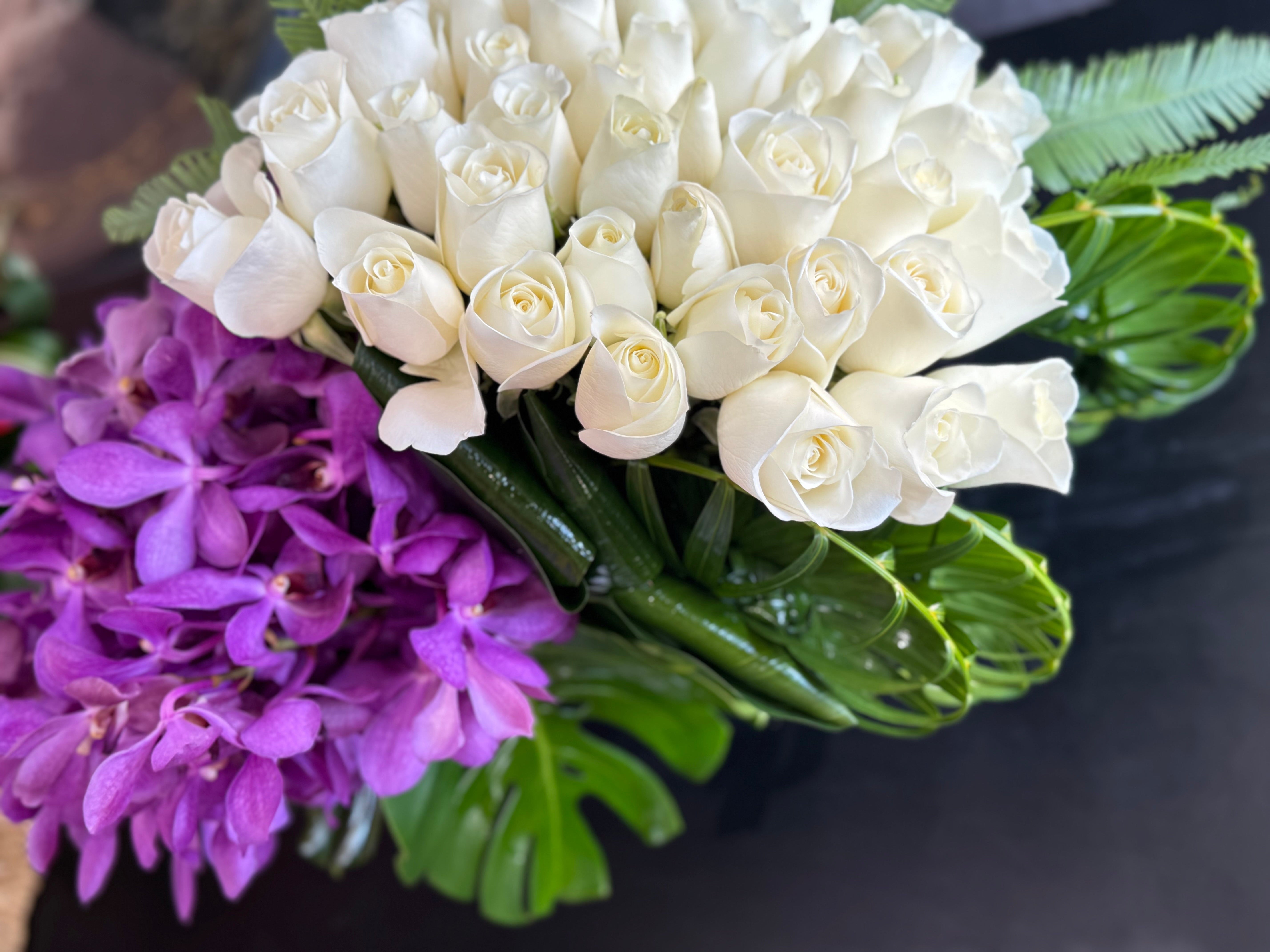 Luxury white rose and tropical orchid arrangement in Miami Beach