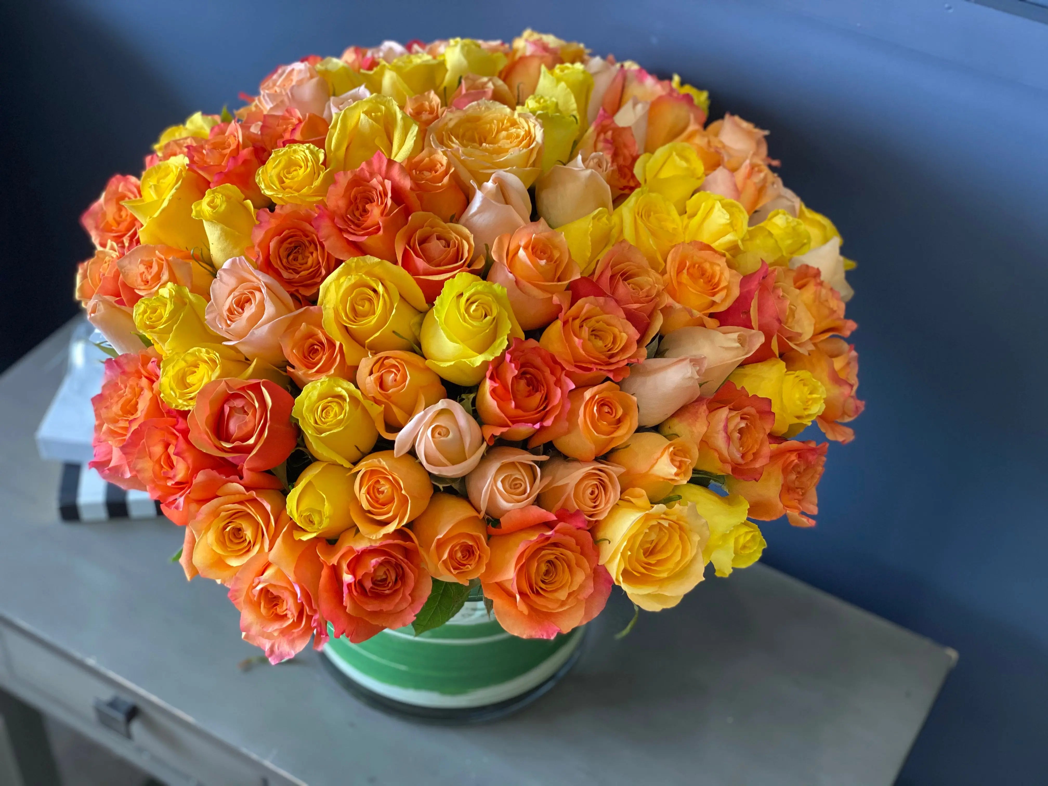 Luxury yellow and orange roses in a vase Miami Beach