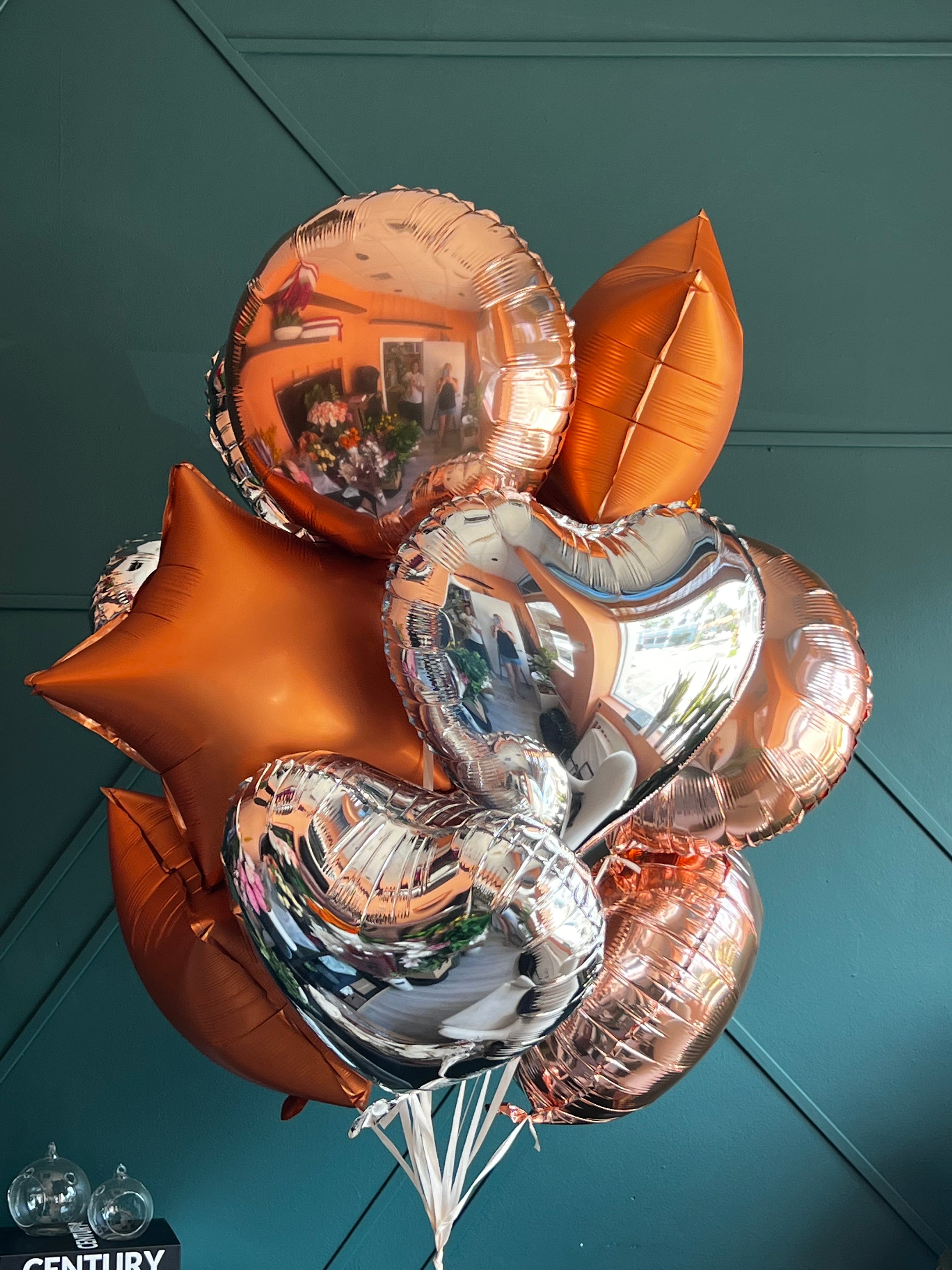 Metallic heart and star balloons for bridal showers and events