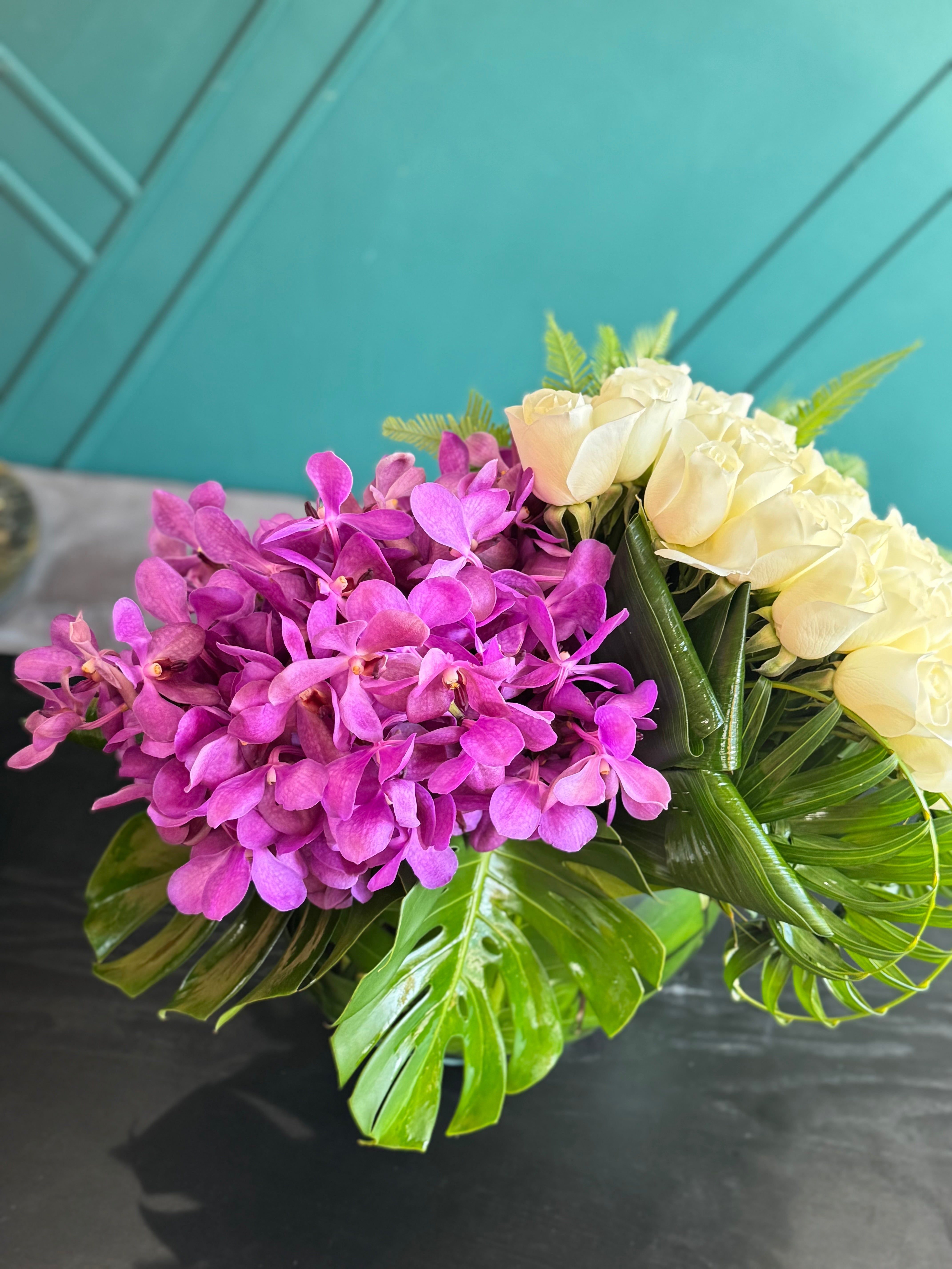 Miami luxury flower arrangement with white roses and vibrant orchids