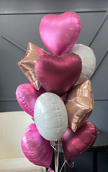 Mixed color balloon arrangement for hotel room surprises in Miami