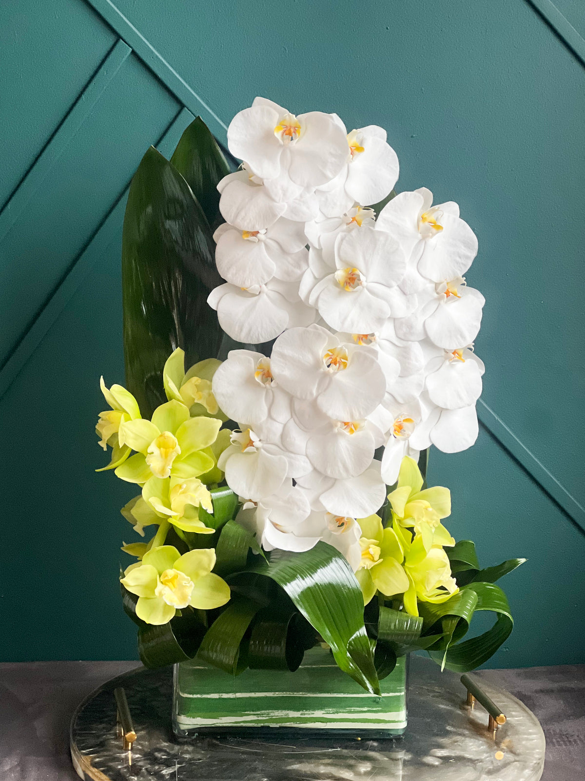 Modern Lines white orchid arrangement for delivery in Miami Beach