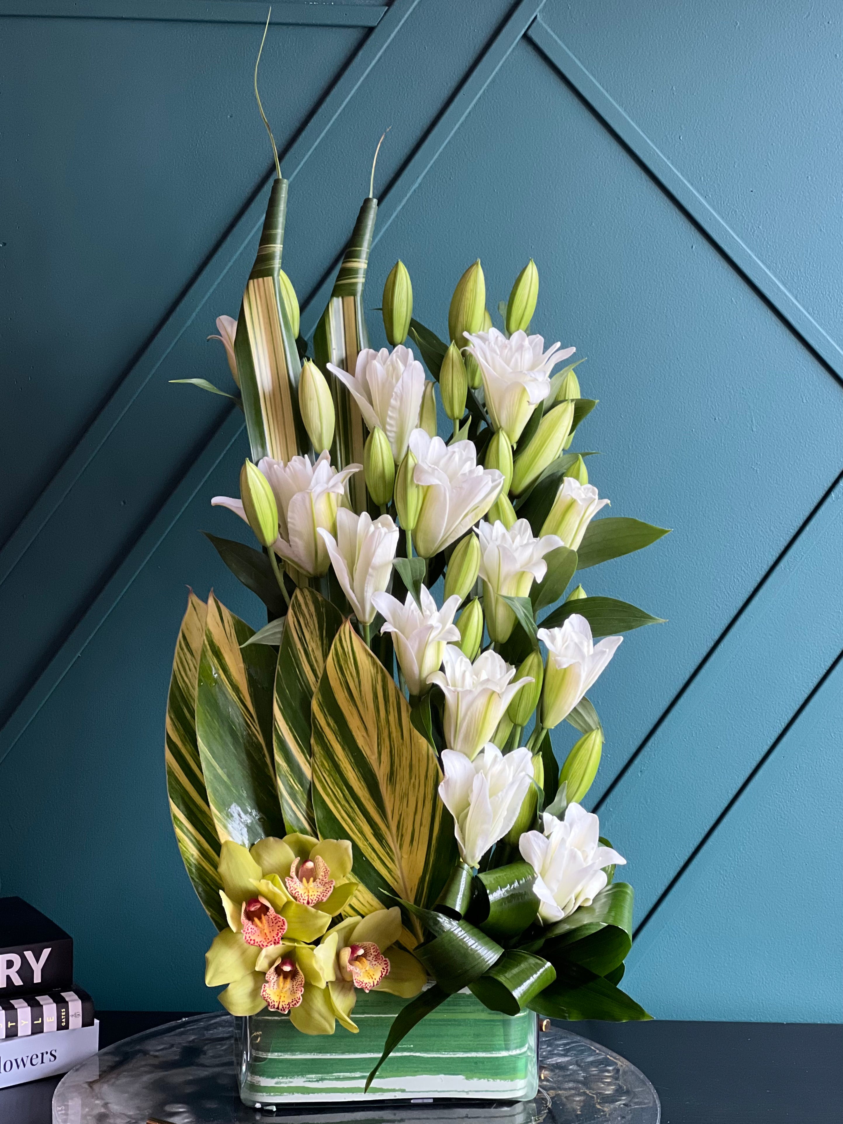 Modern orchid and lily arrangement for Miami flower delivery