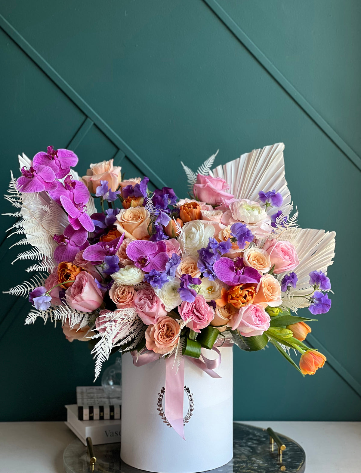 Modern orchid and rose arrangement for luxury flower delivery Miami