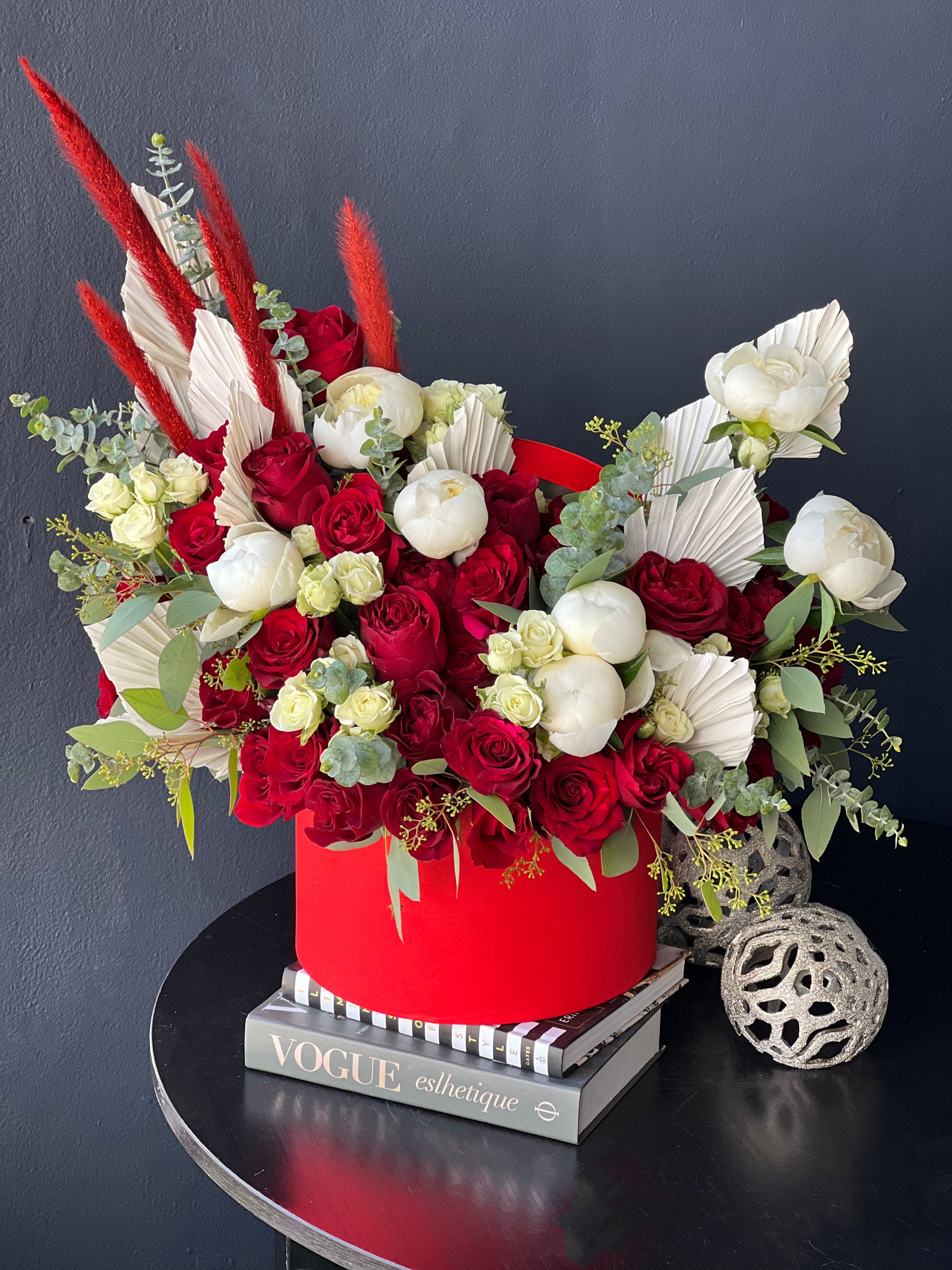 Modern red and white floral arrangement with roses and peonies Miami