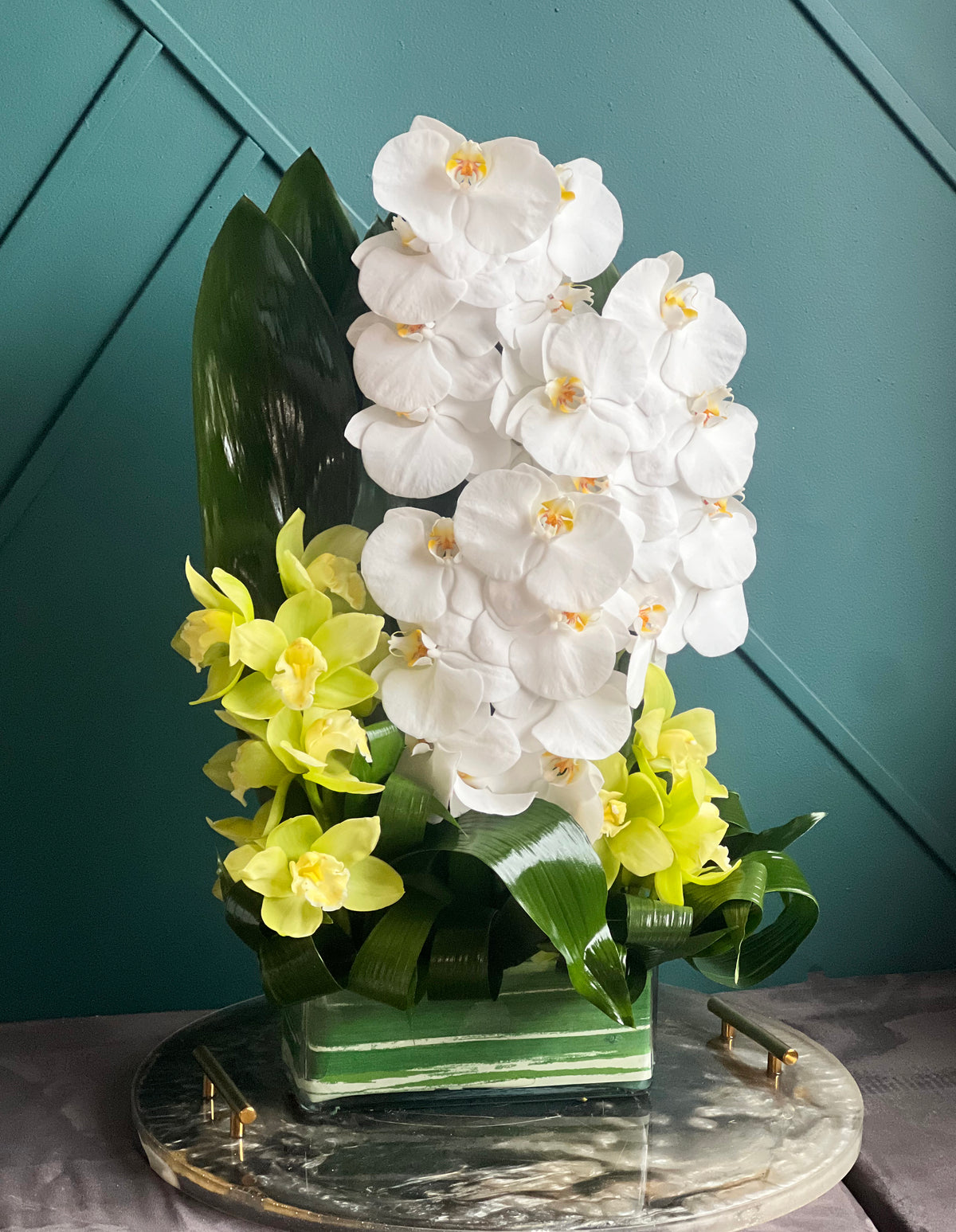 Modern white orchid flower arrangement for delivery in Miami