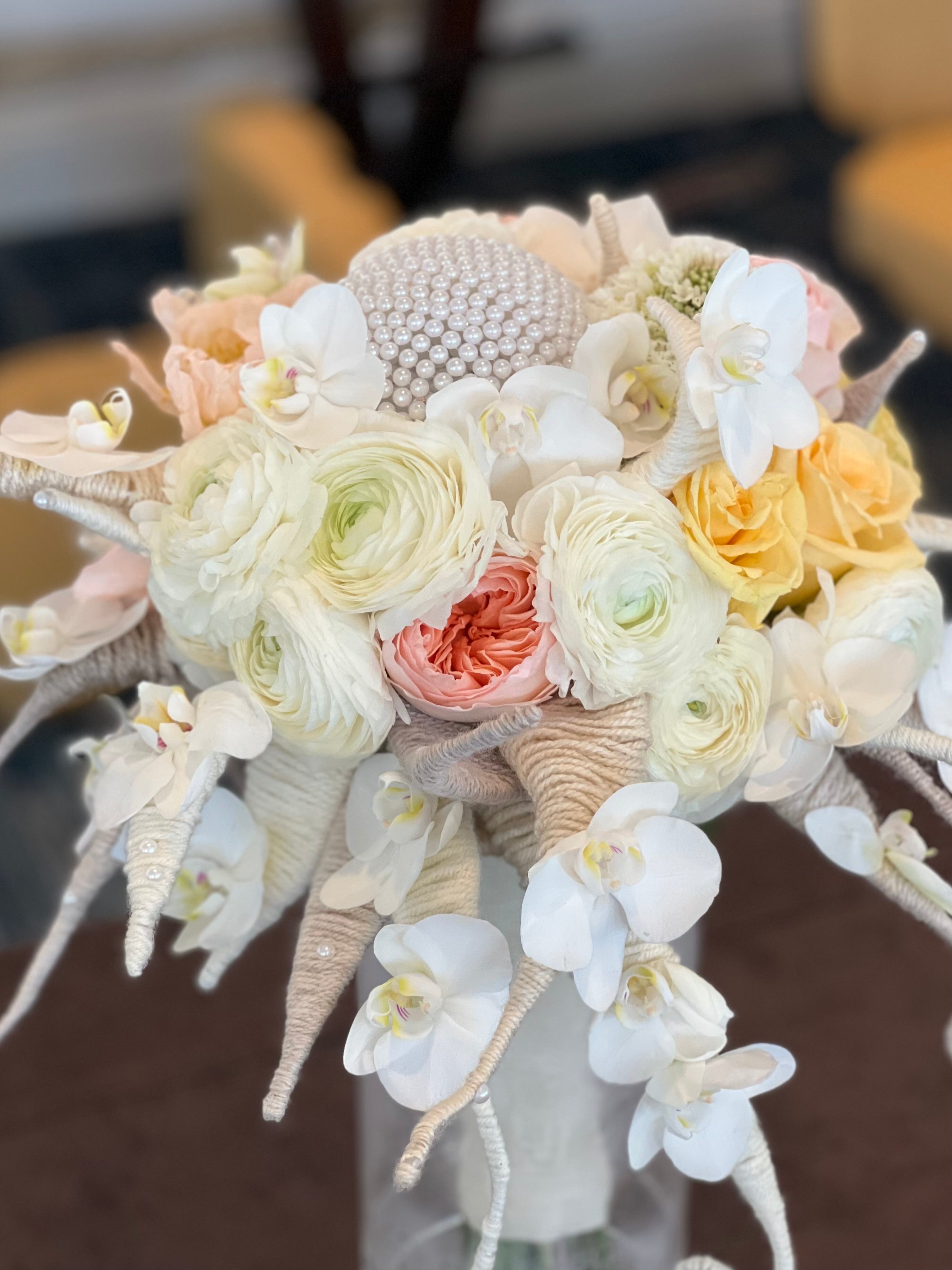 One-of-a-kind bridal bouquet with white Phalaenopsis orchids