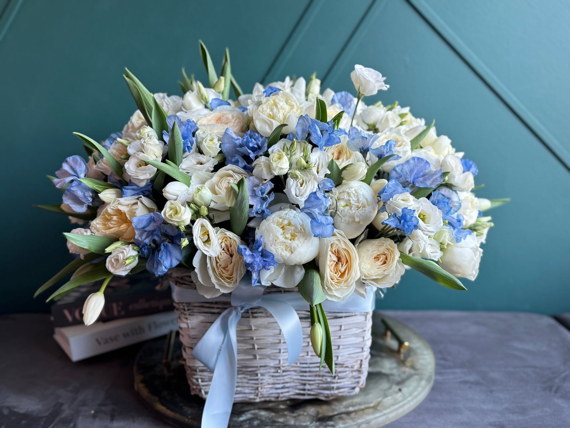 Oversized peony and garden rose arrangement in woven basket Miami Beach