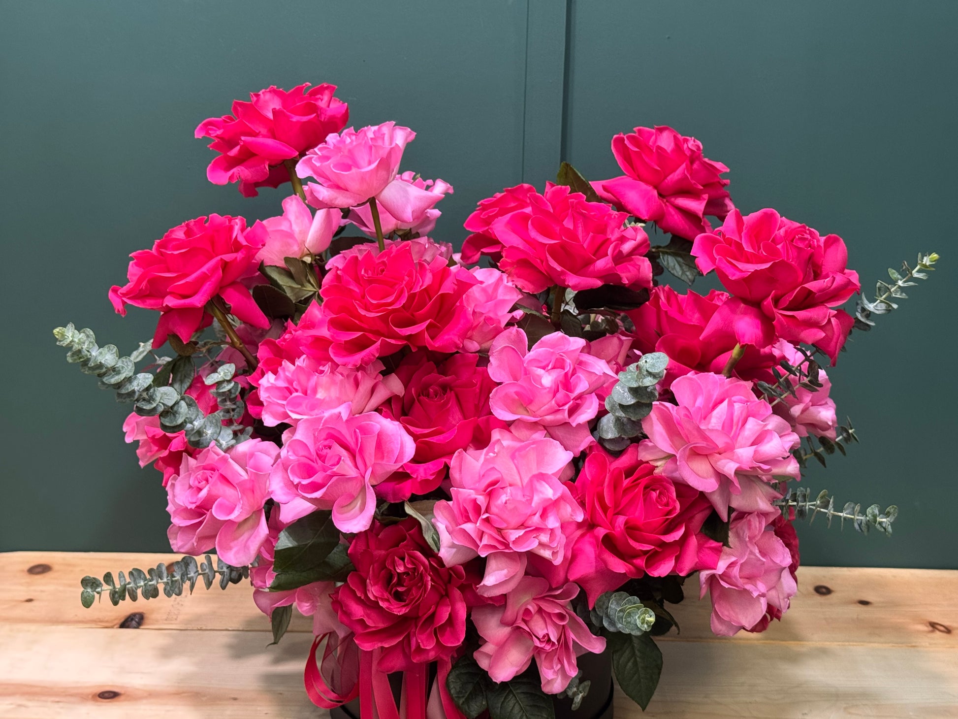 Parisian style rose arrangement with pink French roses in a black box