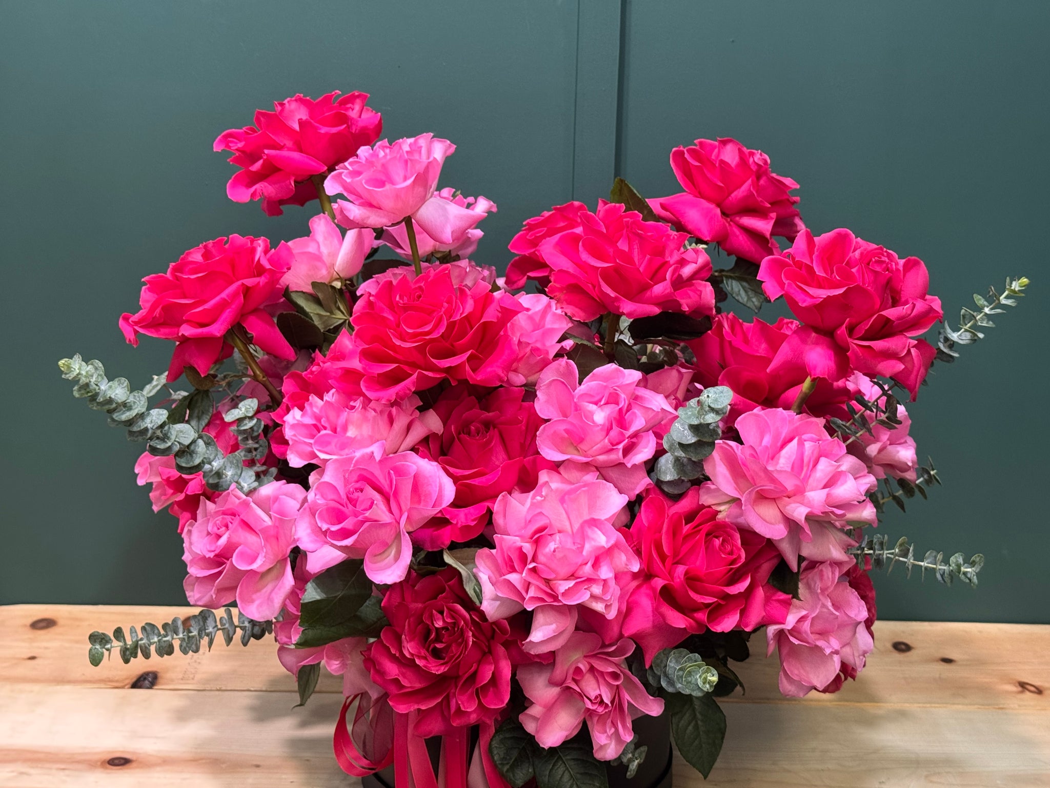 Parisian style rose arrangement with pink French roses in a black box