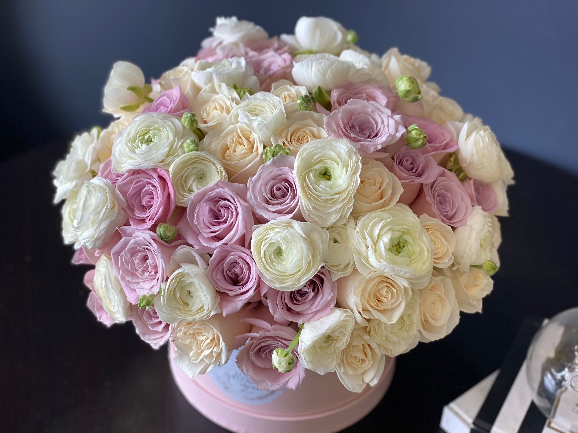 Pastel roses and ranunculus arrangement by Luxury Flowers Miami