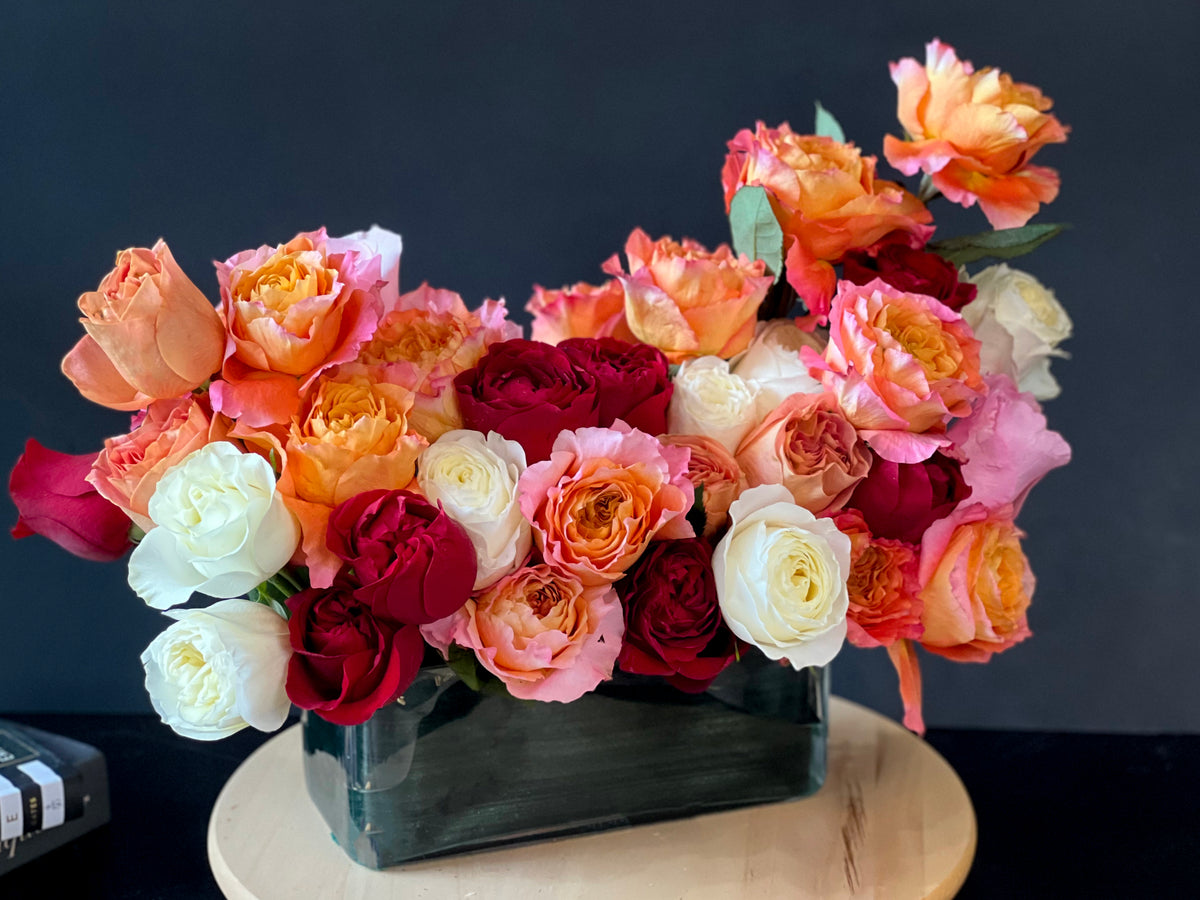 Pink coral and peach garden roses arrangement