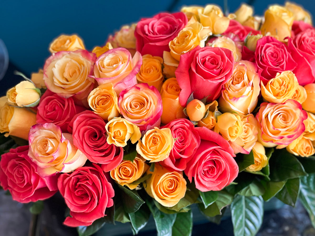 Pink peach orange and yellow roses arrangement Miami